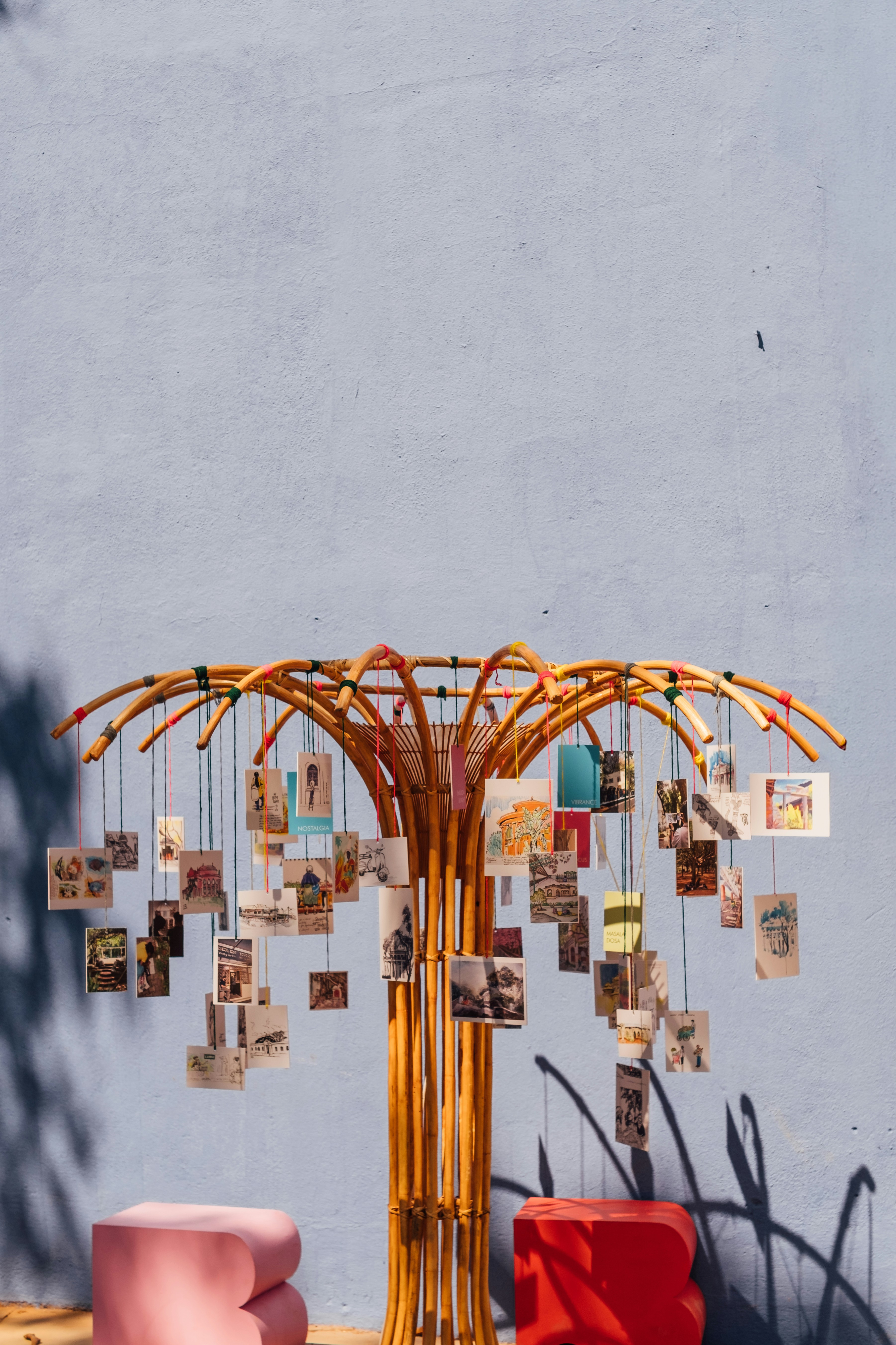 A decorative tree displaying small cards and photos