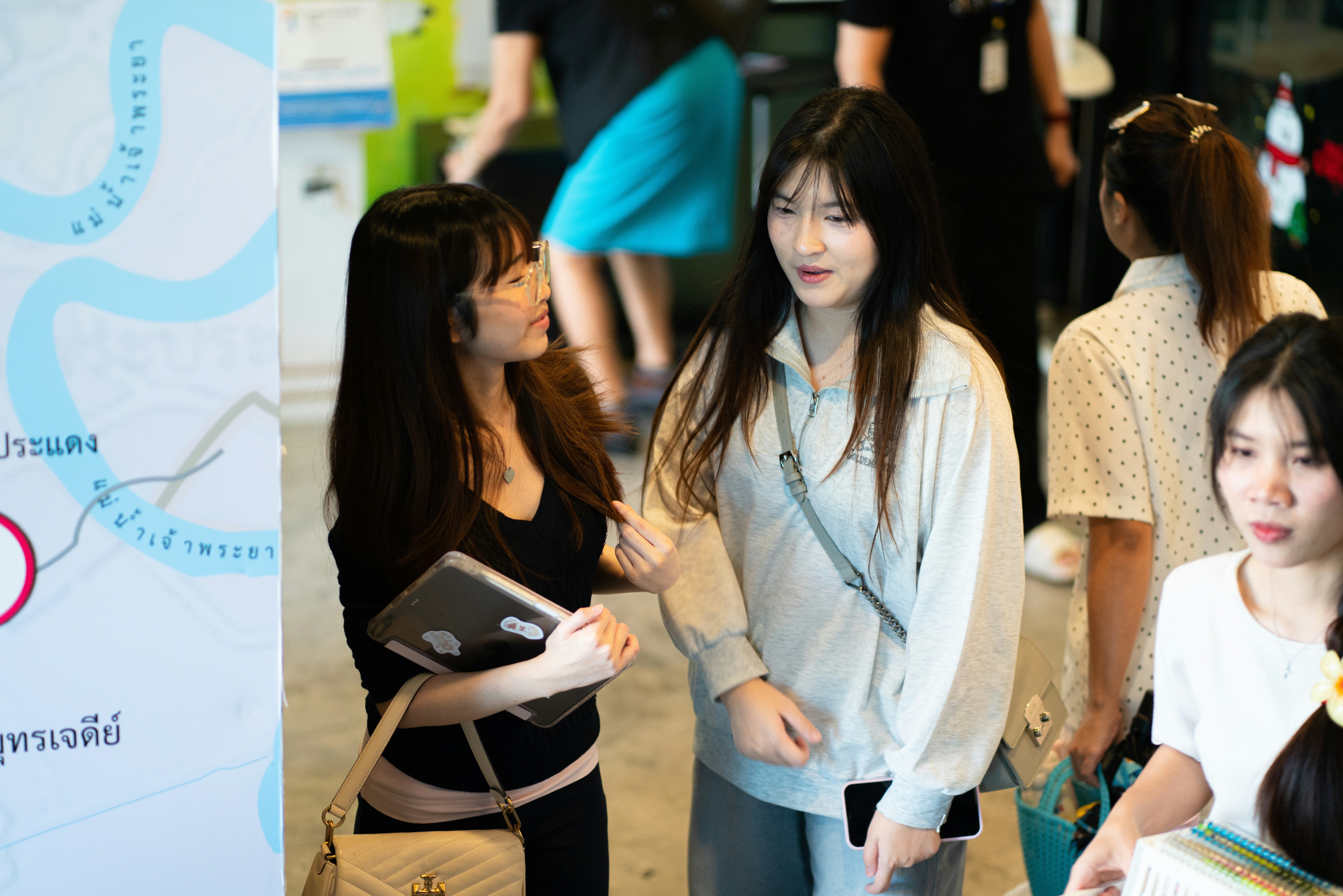 Two young women looking at a map