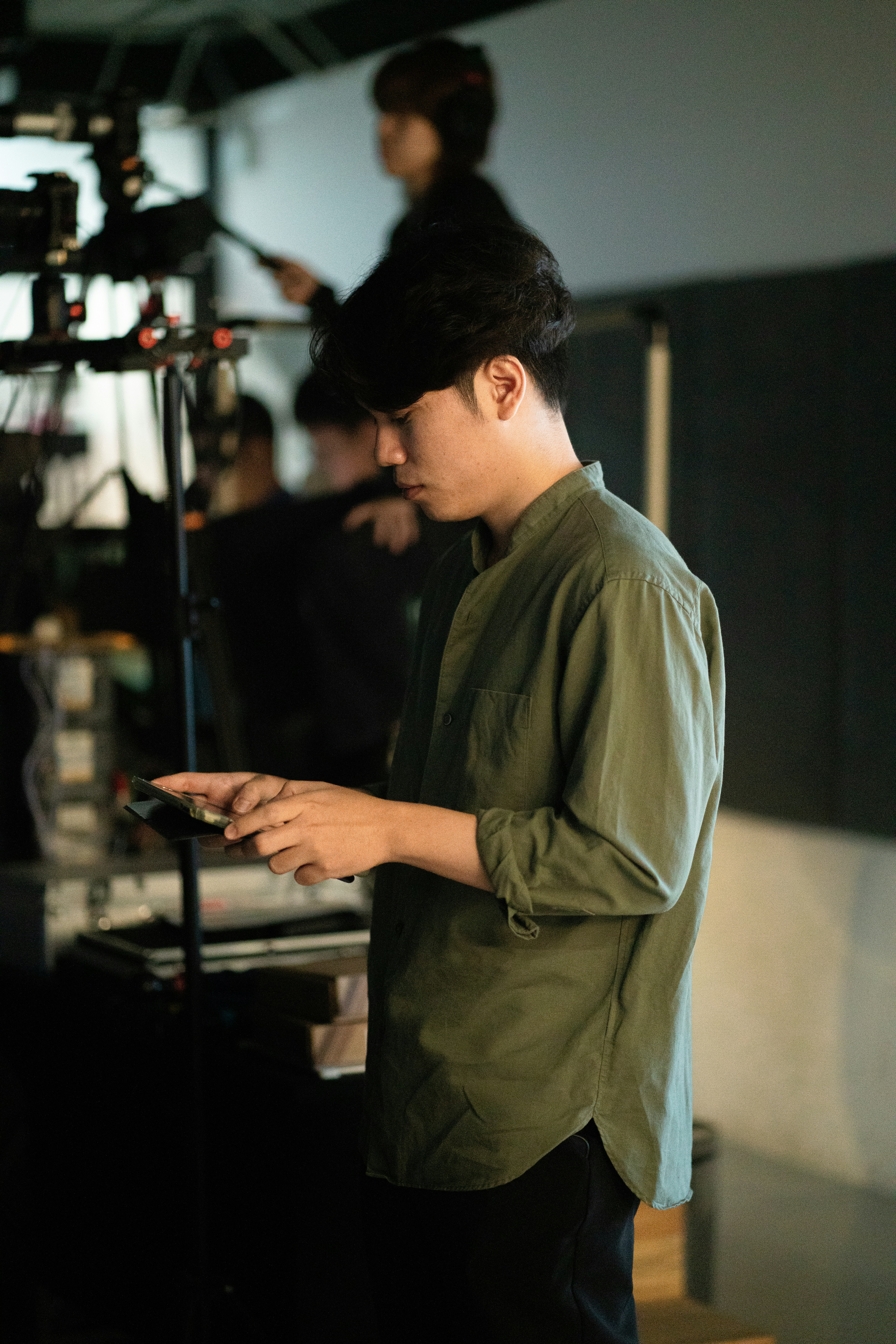 A man operating equipment on a film set.