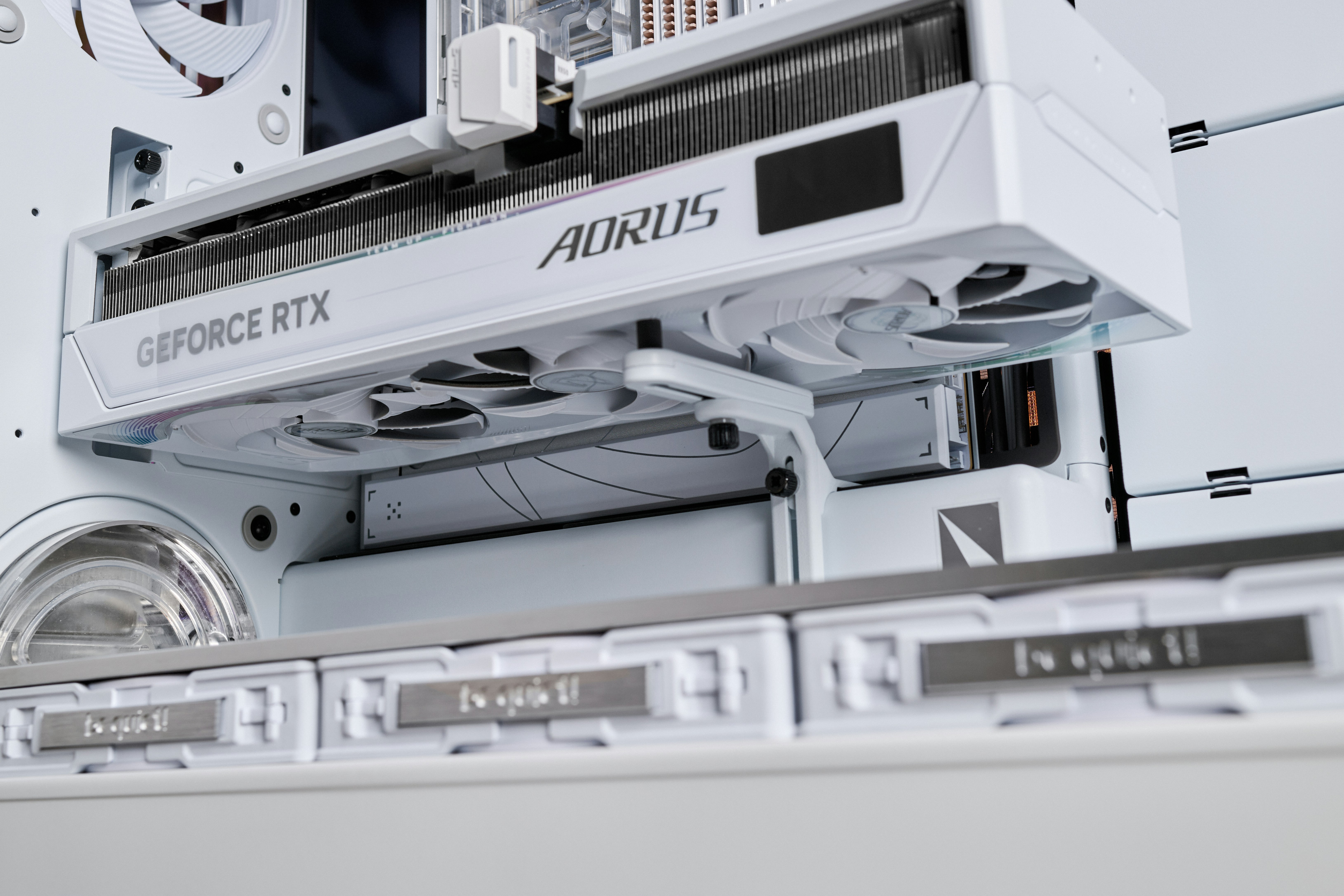 White computer components with aorus geforce rtx graphics card