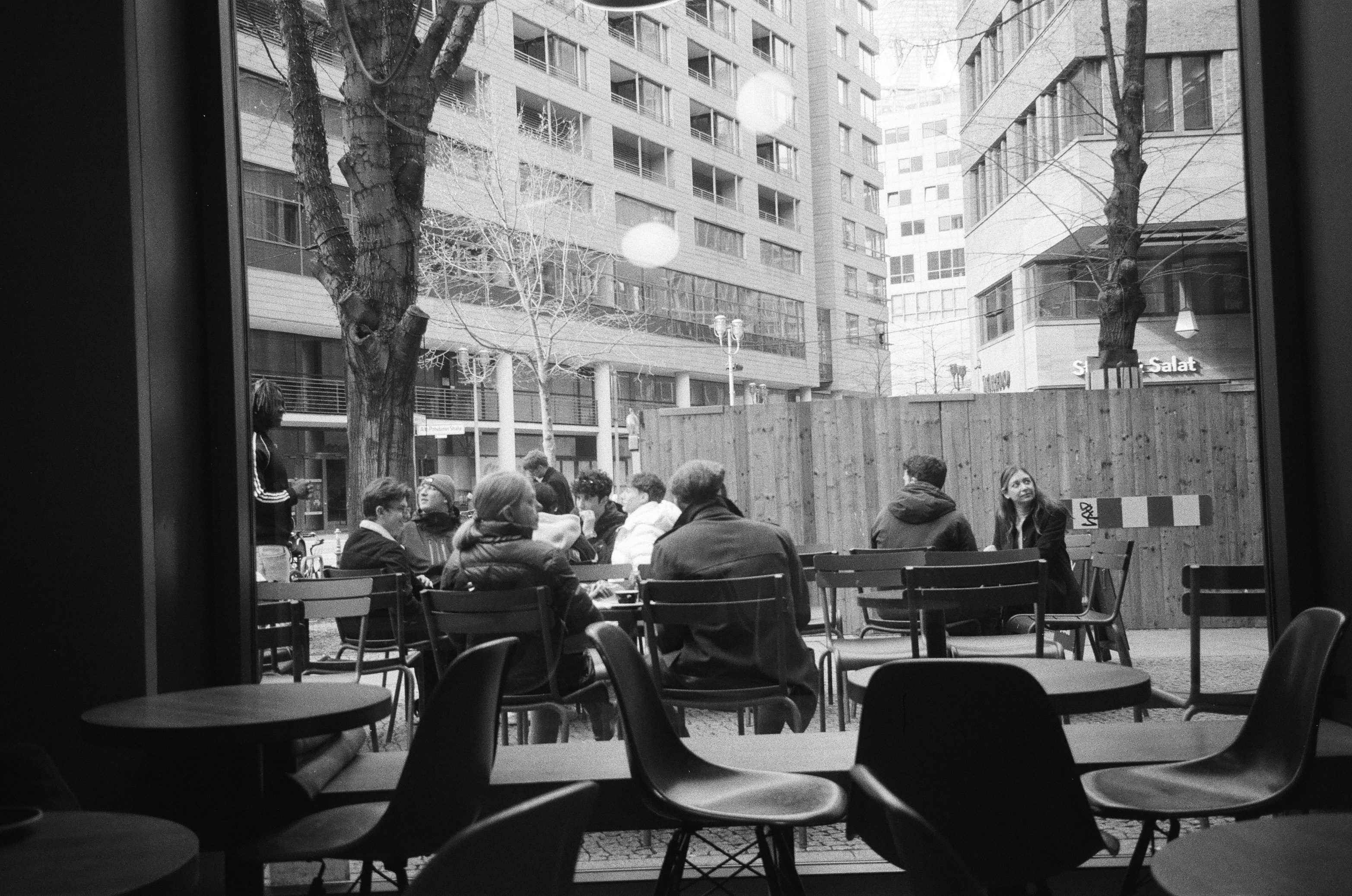 People chatting at a café table