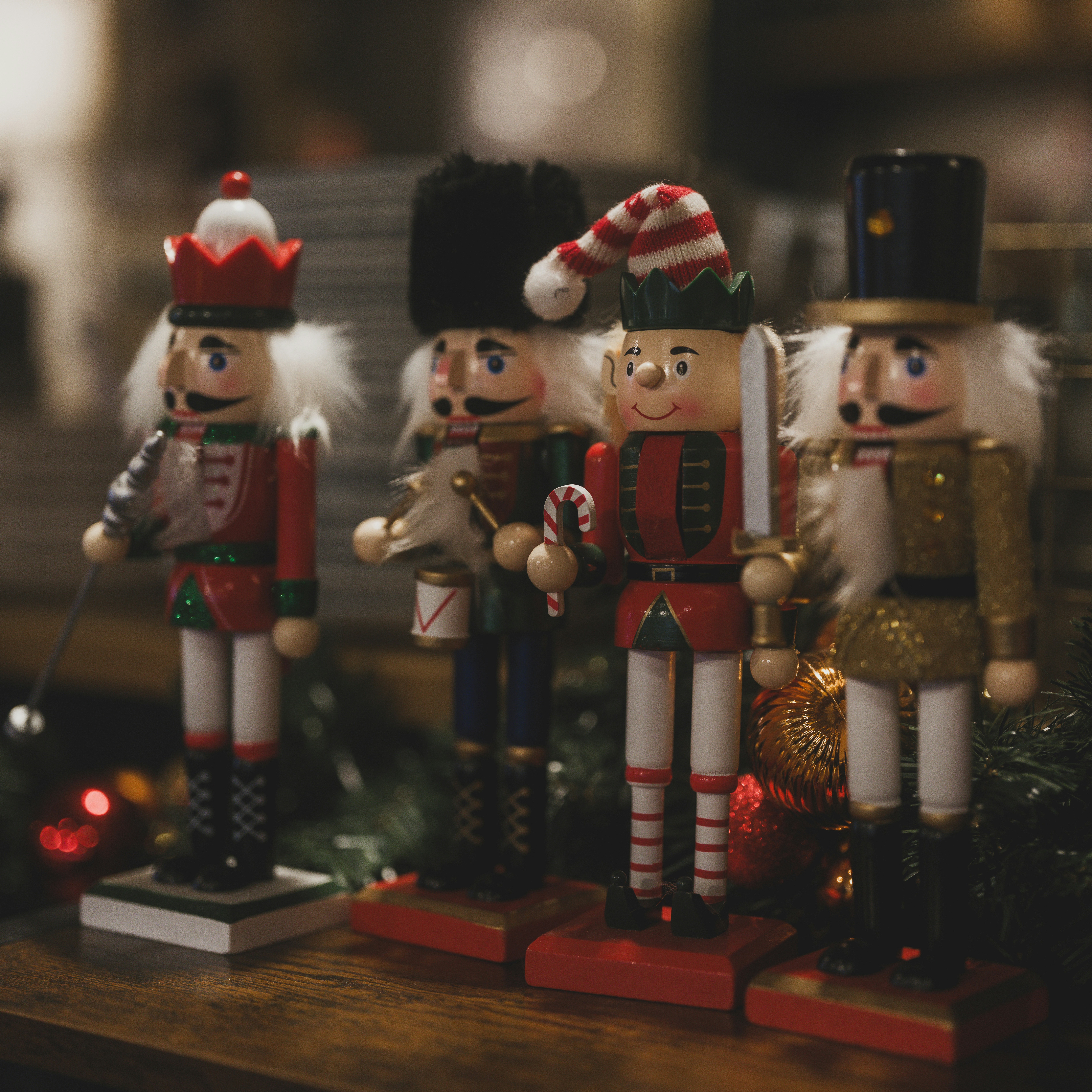 Four festive nutcracker figures stand in a row.