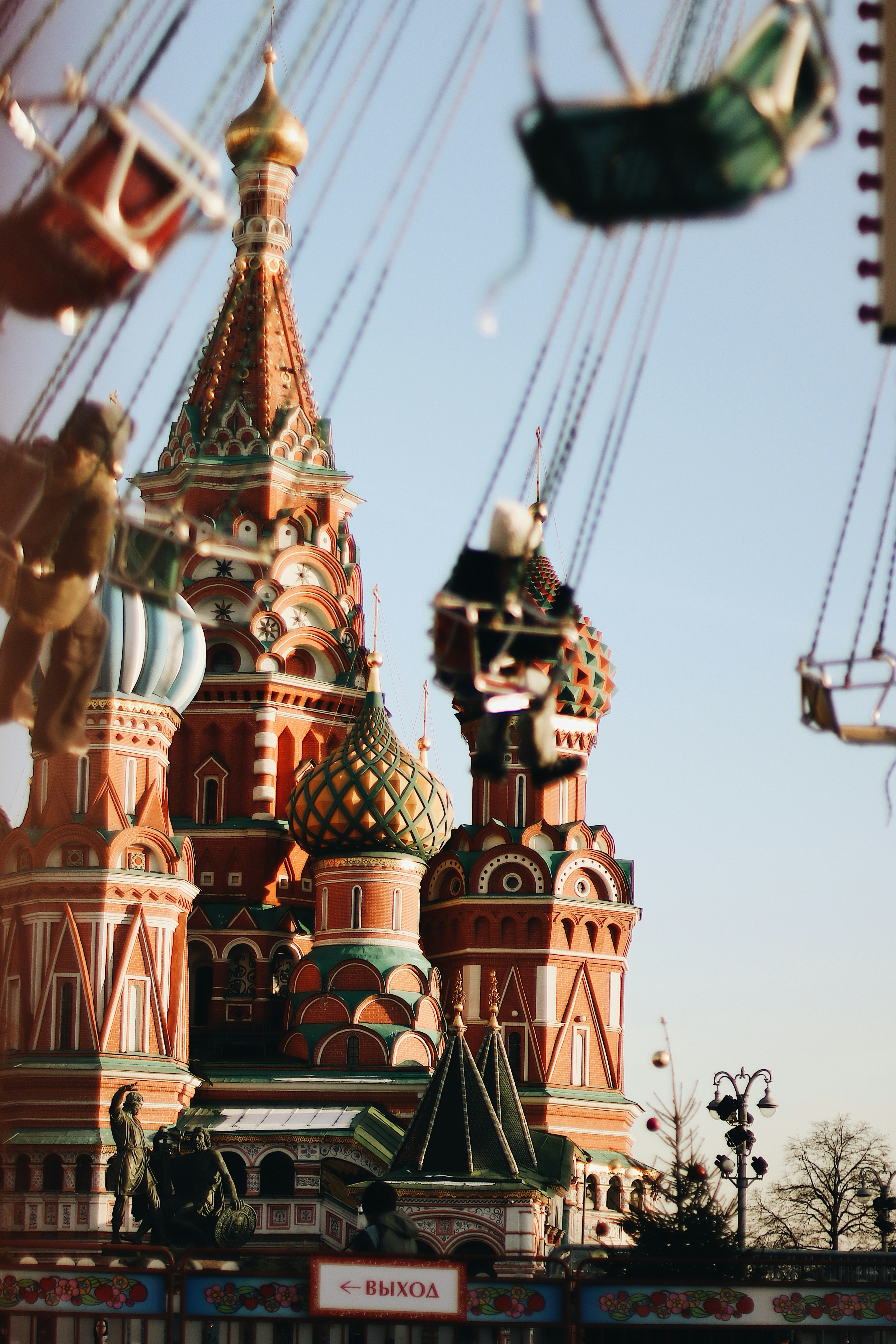 Colorful st. basil's cathedral with swing rides