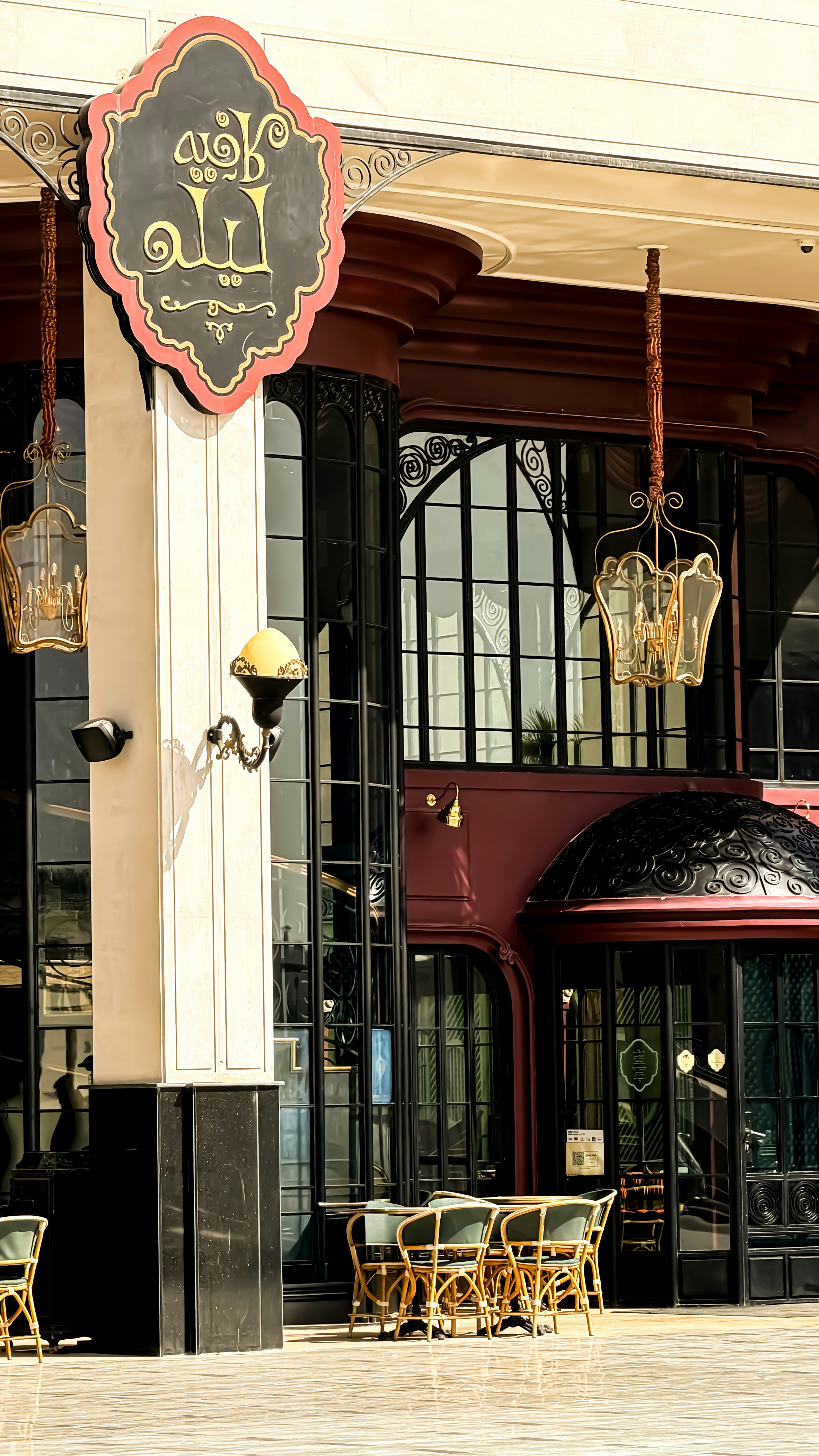 Cafe with outdoor seating and ornate lanterns
