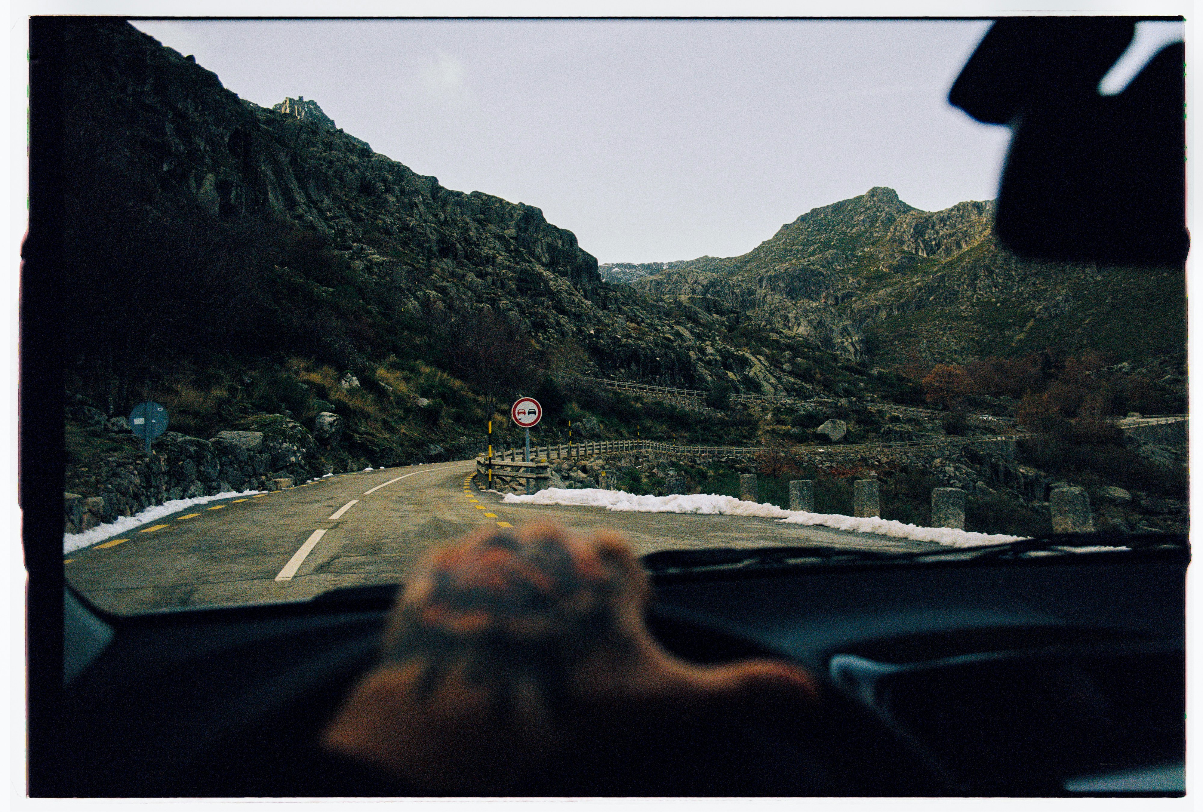 Driving on a winding mountain road in winter