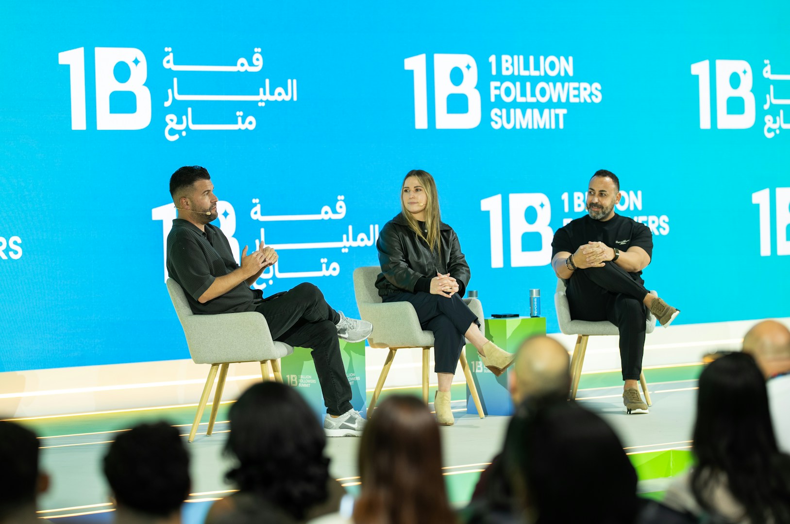 Three experts on stage at an authority and brand summit