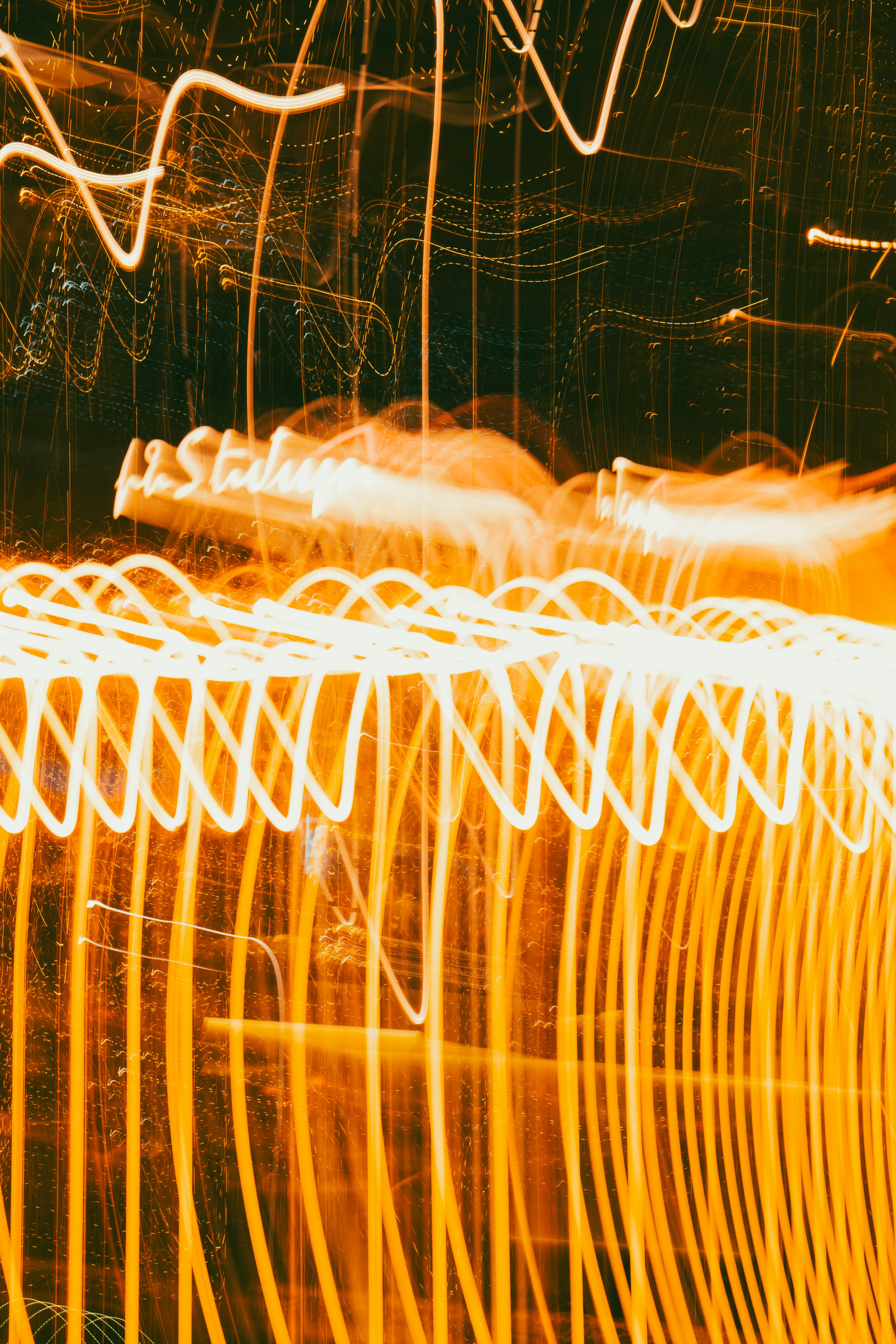 Abstract light trails in warm orange hues