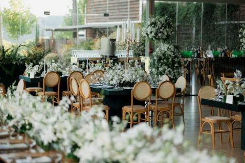 Elegant wedding reception with floral arrangements and seating.