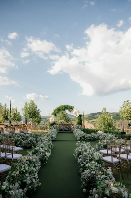 Outdoor wedding ceremony with floral arrangements