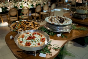 Buffet table with assorted pastries and tarts
