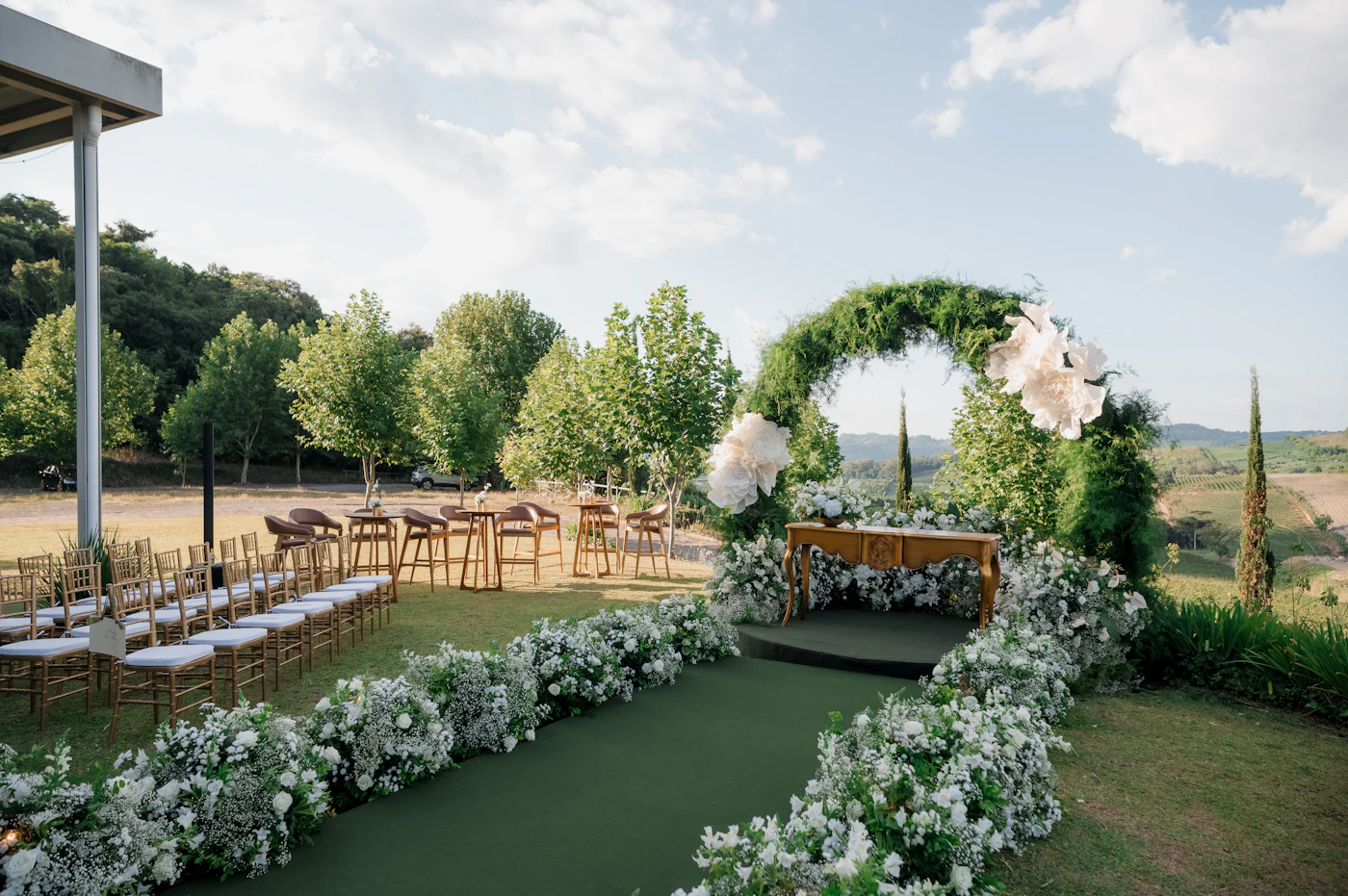 Affordable wedding venues in New York City — An intimate wedding reception set in a lush, green park pavilion in New York City.