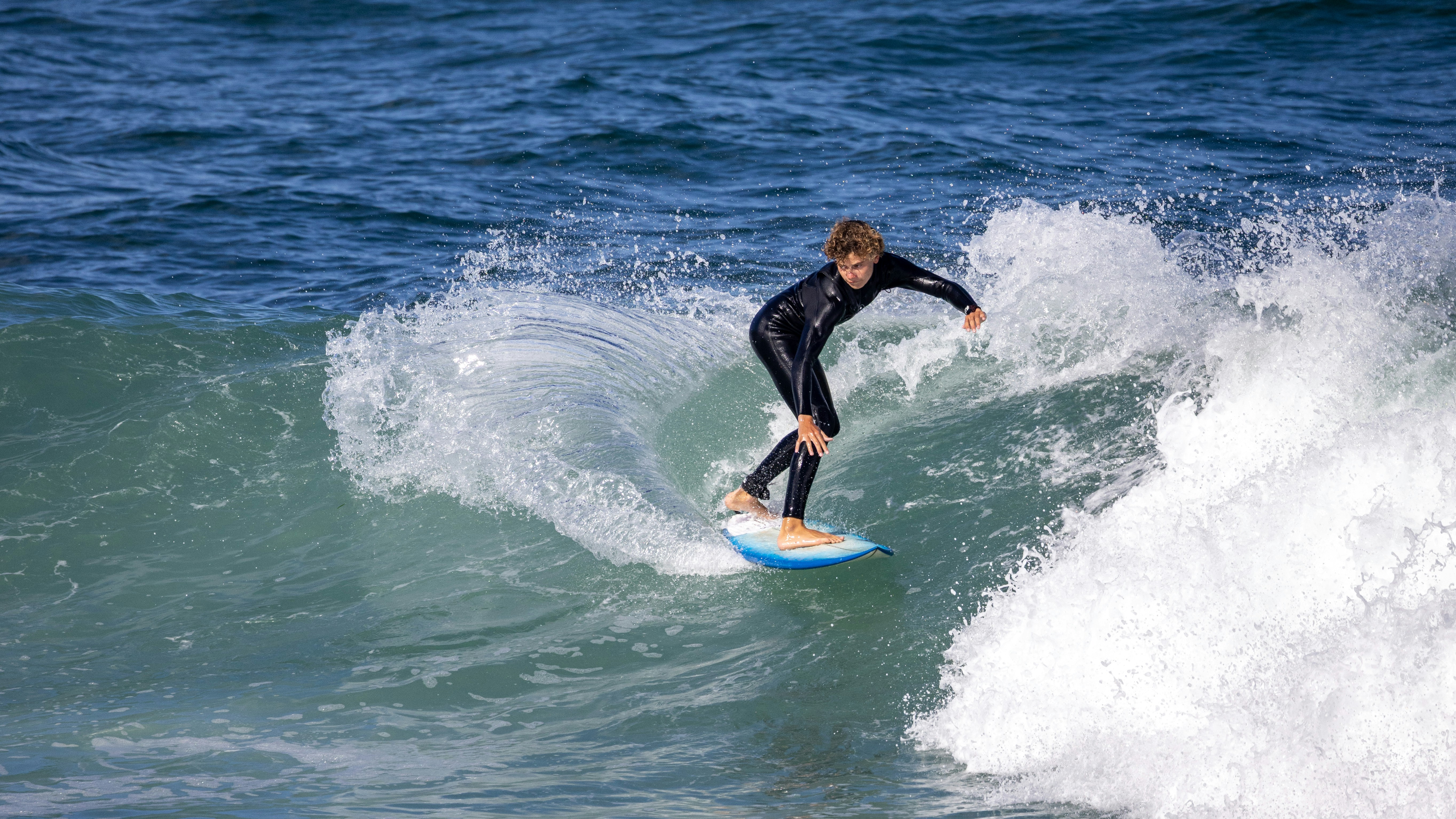 Surfer riding a wave in the ocean