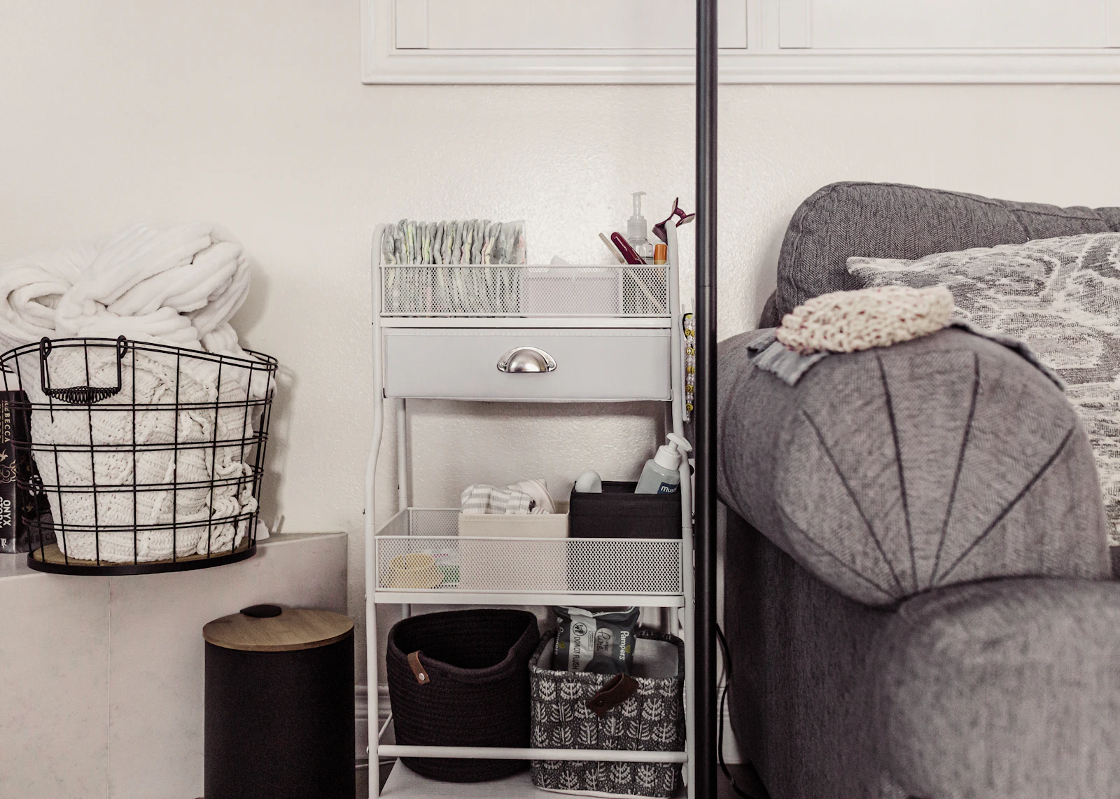 Real nursery storage cart arranged with baby care essentials