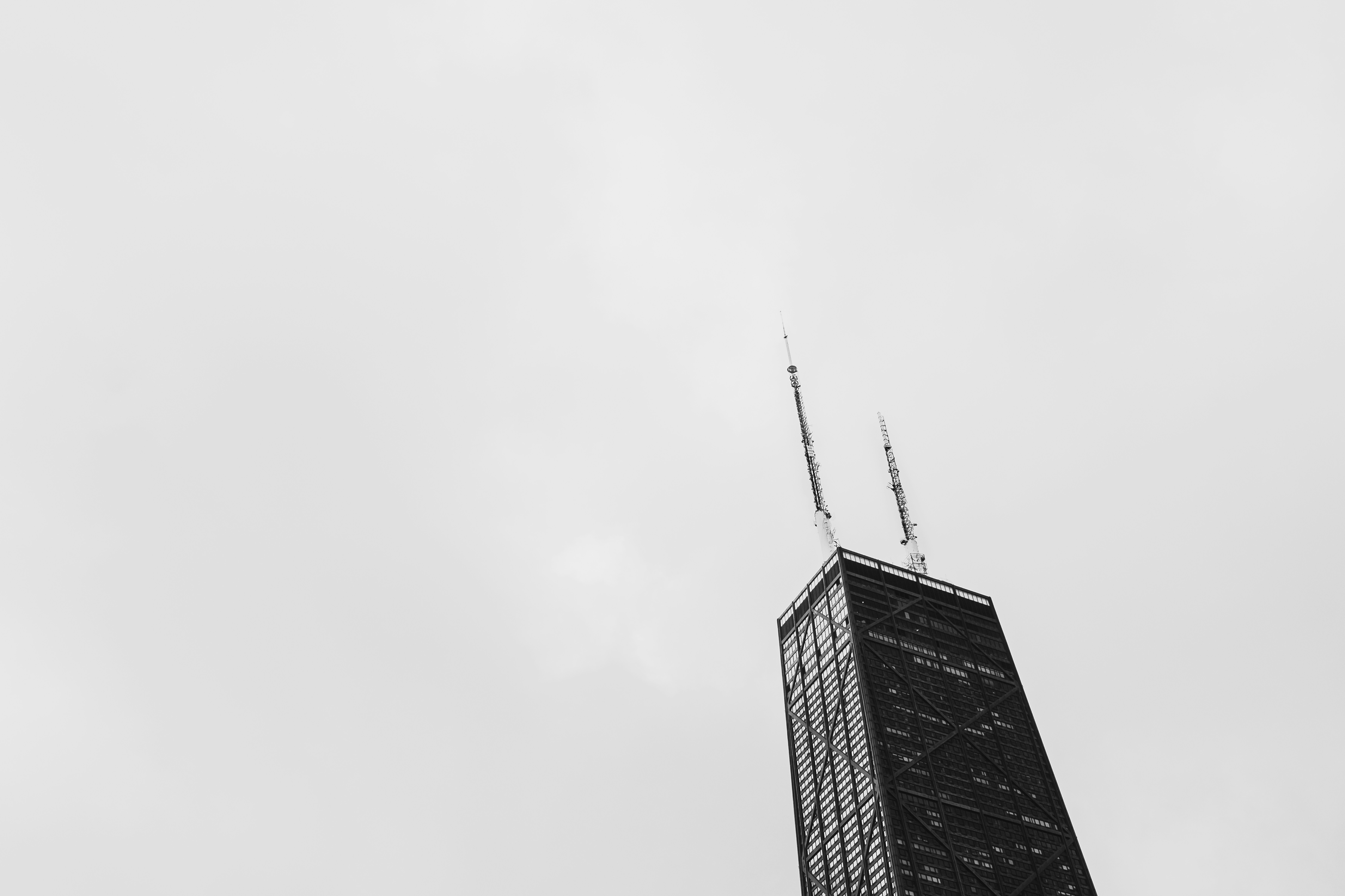 Tall skyscraper against a cloudy sky