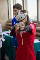Young woman wearing vr headset plays game