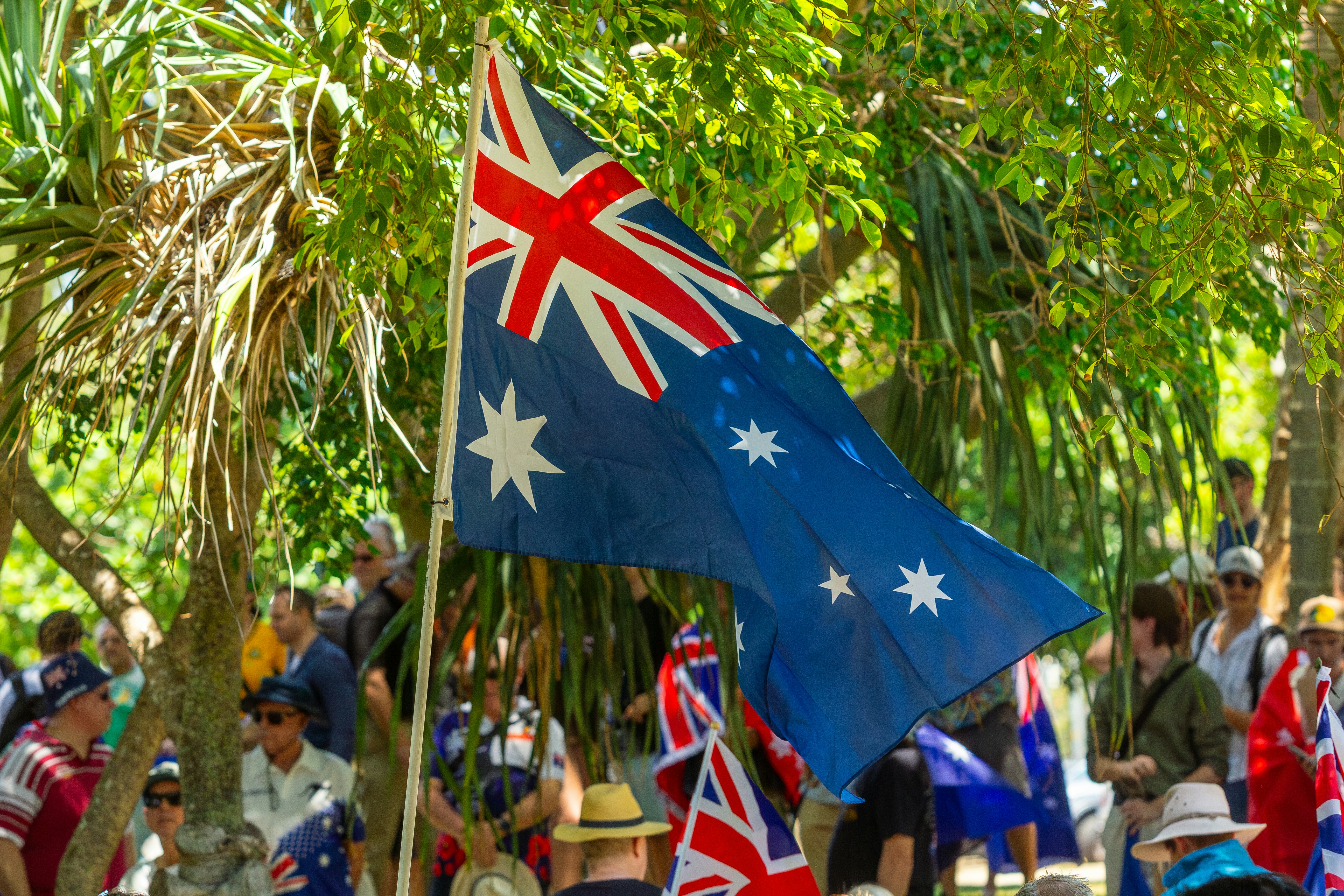 Australian flag waving with people in background