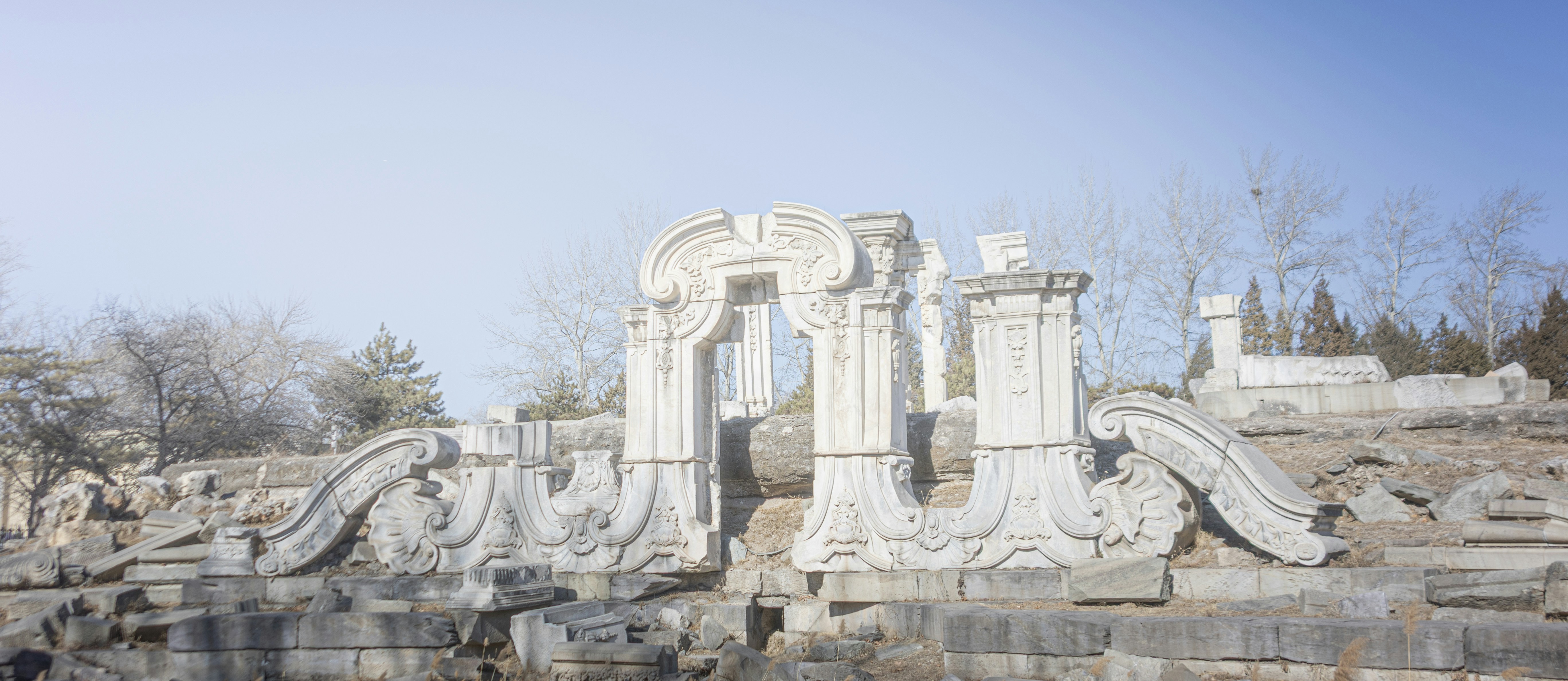 Ancient stone ruins with ornate carvings and a clear sky