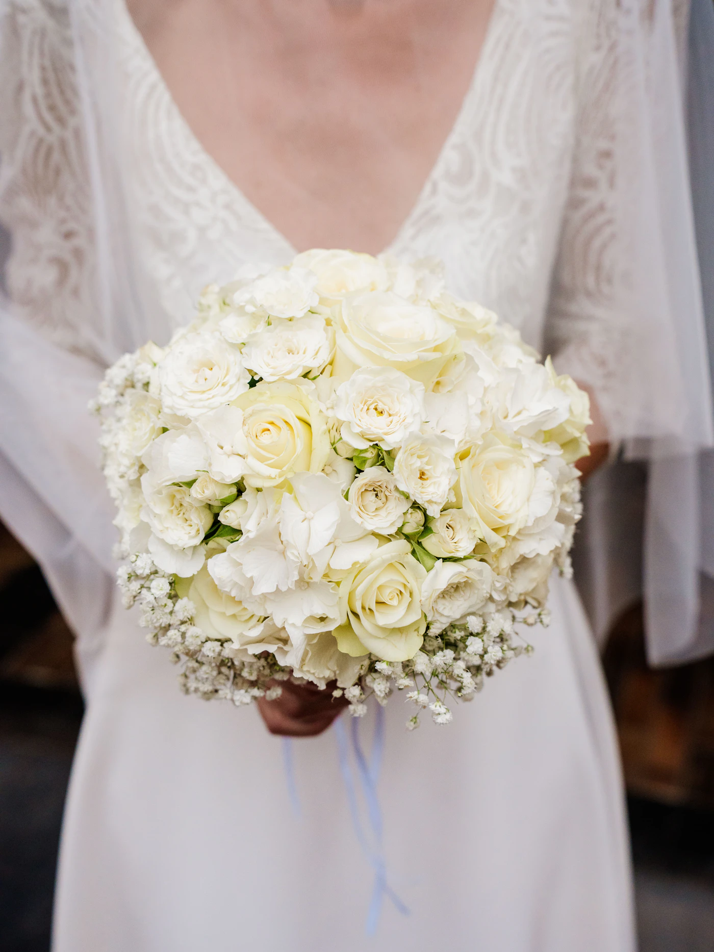How to DIY your own wedding bouquet — A variety of fresh flowers and greenery laid out on a table, ready to be arranged.