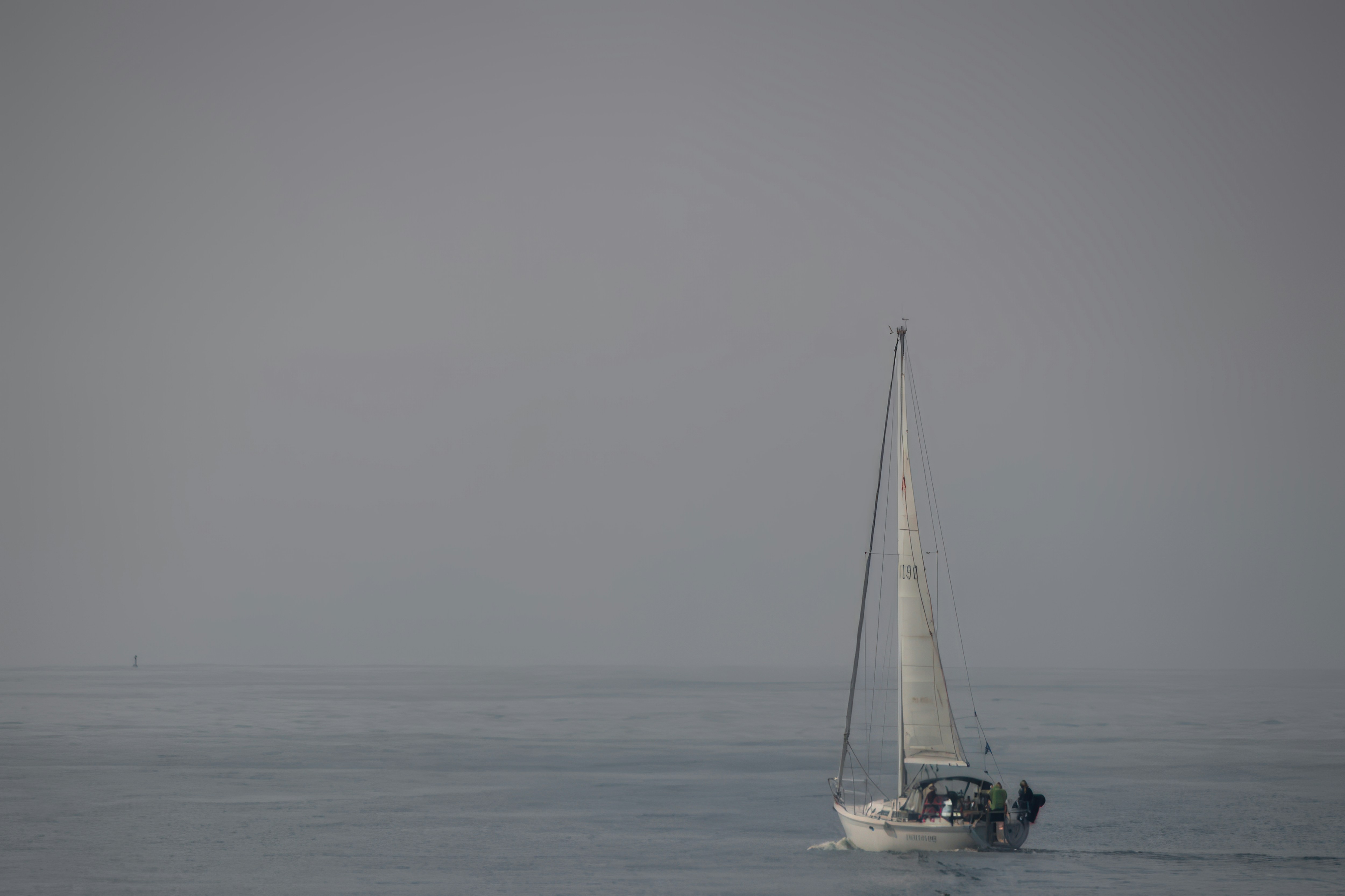 A modern naval frigate sailing in open waters, with a hint of smoke or damage, conveying the idea of a recent incident.