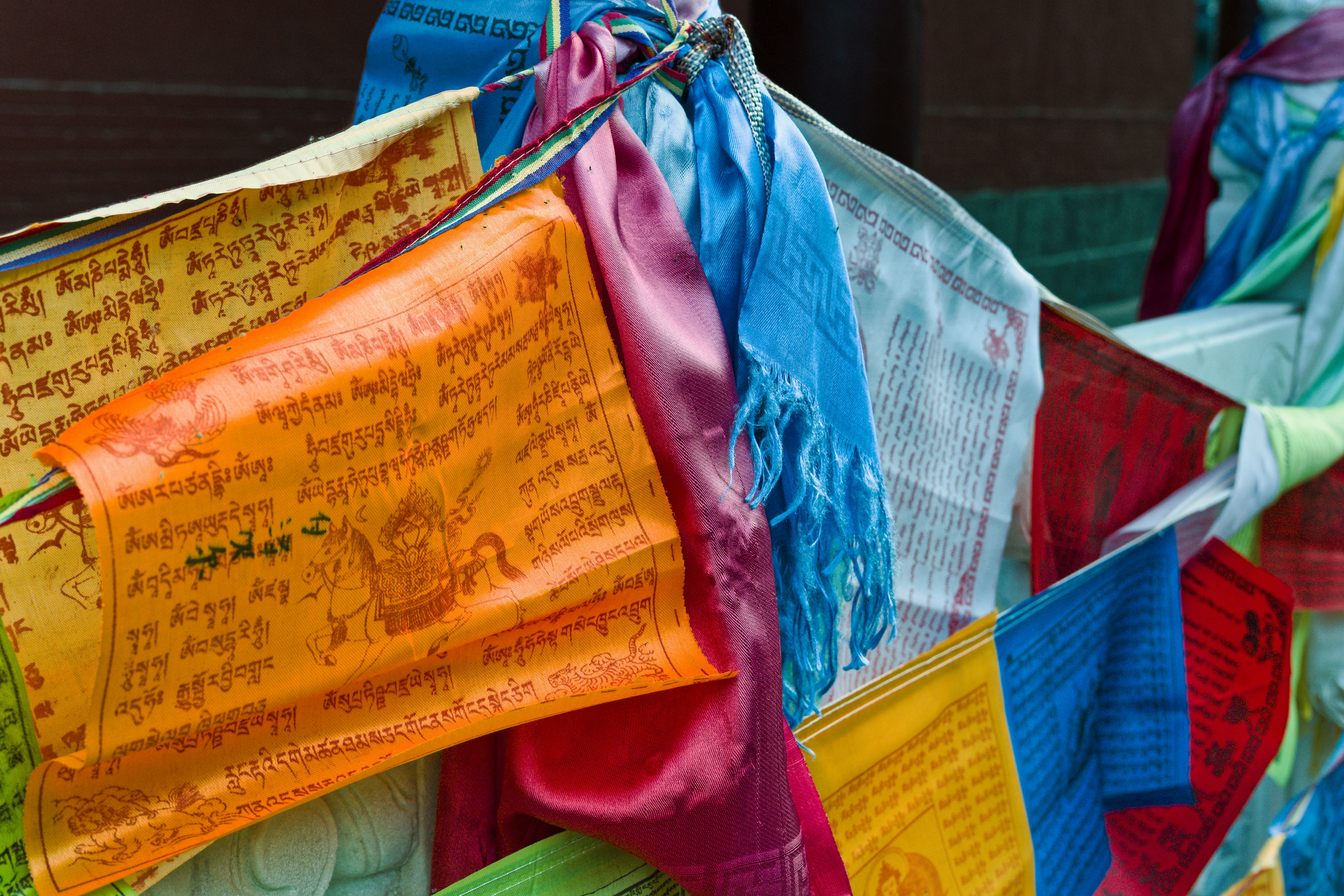 Colorful prayer flags flutter in the wind.