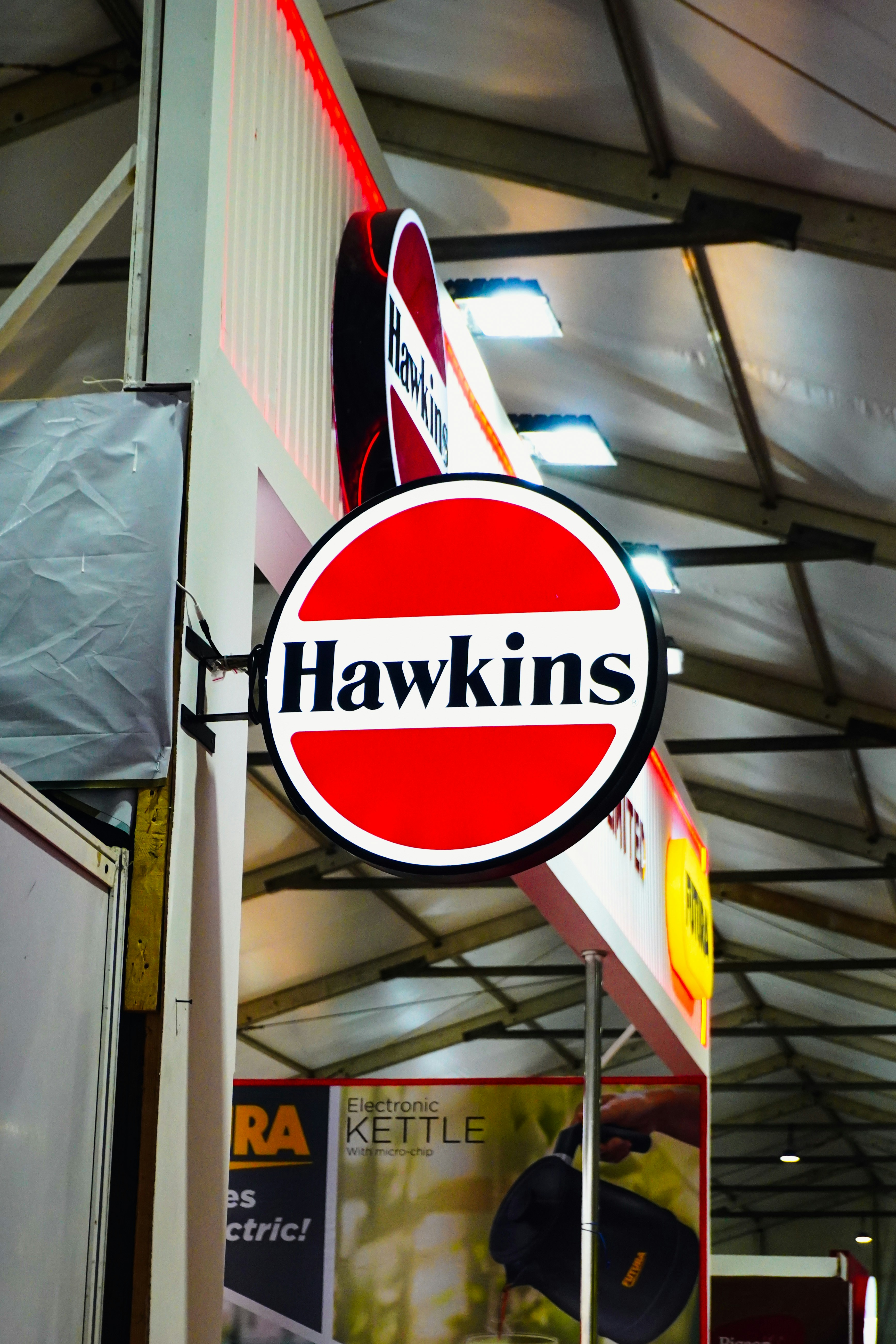 Hawkins brand logo sign with red and white circles