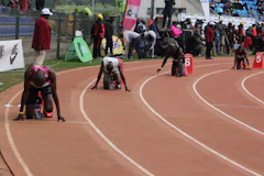 Athletes in the starting blocks on a race track