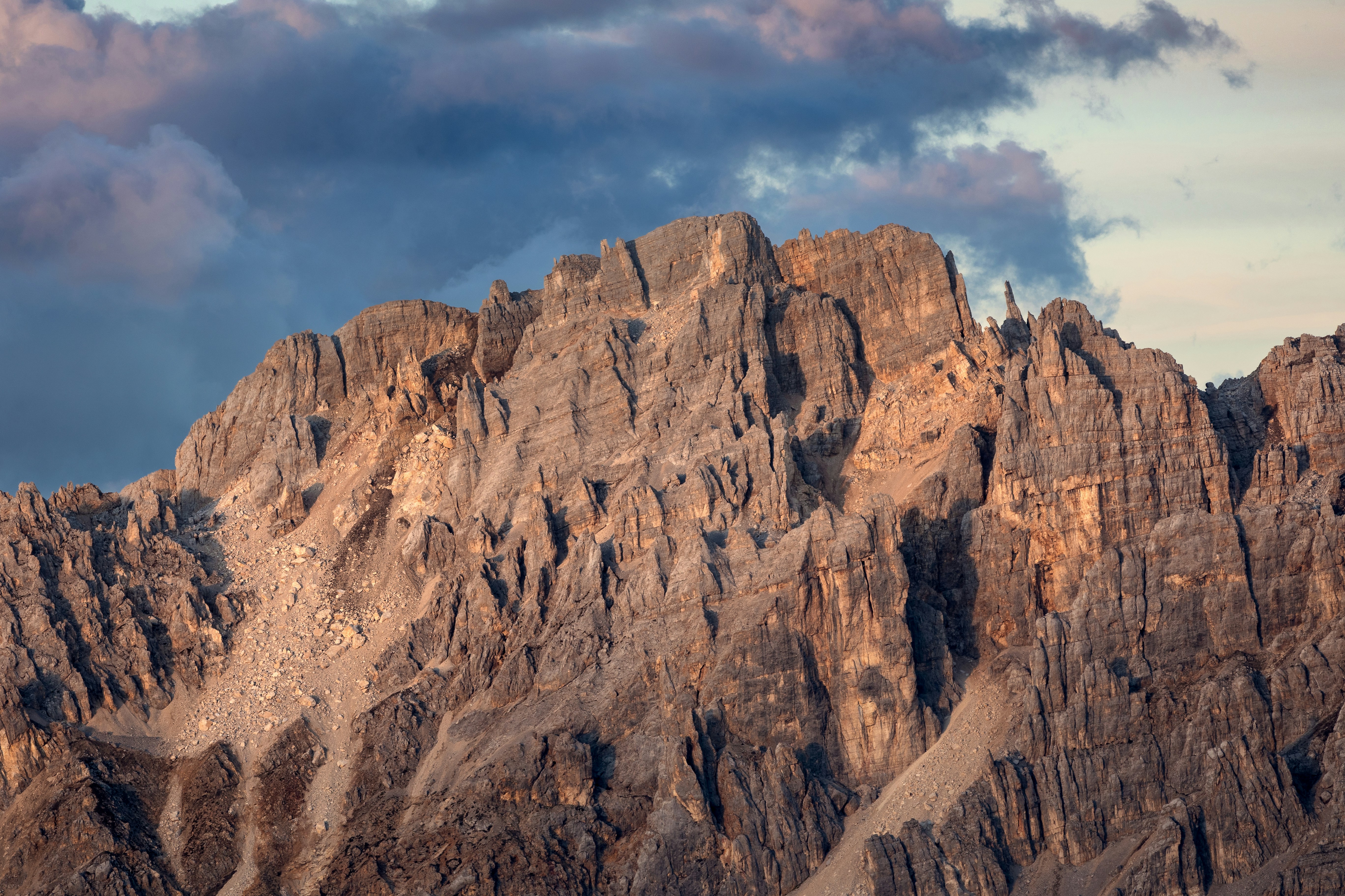Jagged mountain peaks under a cloudy sky