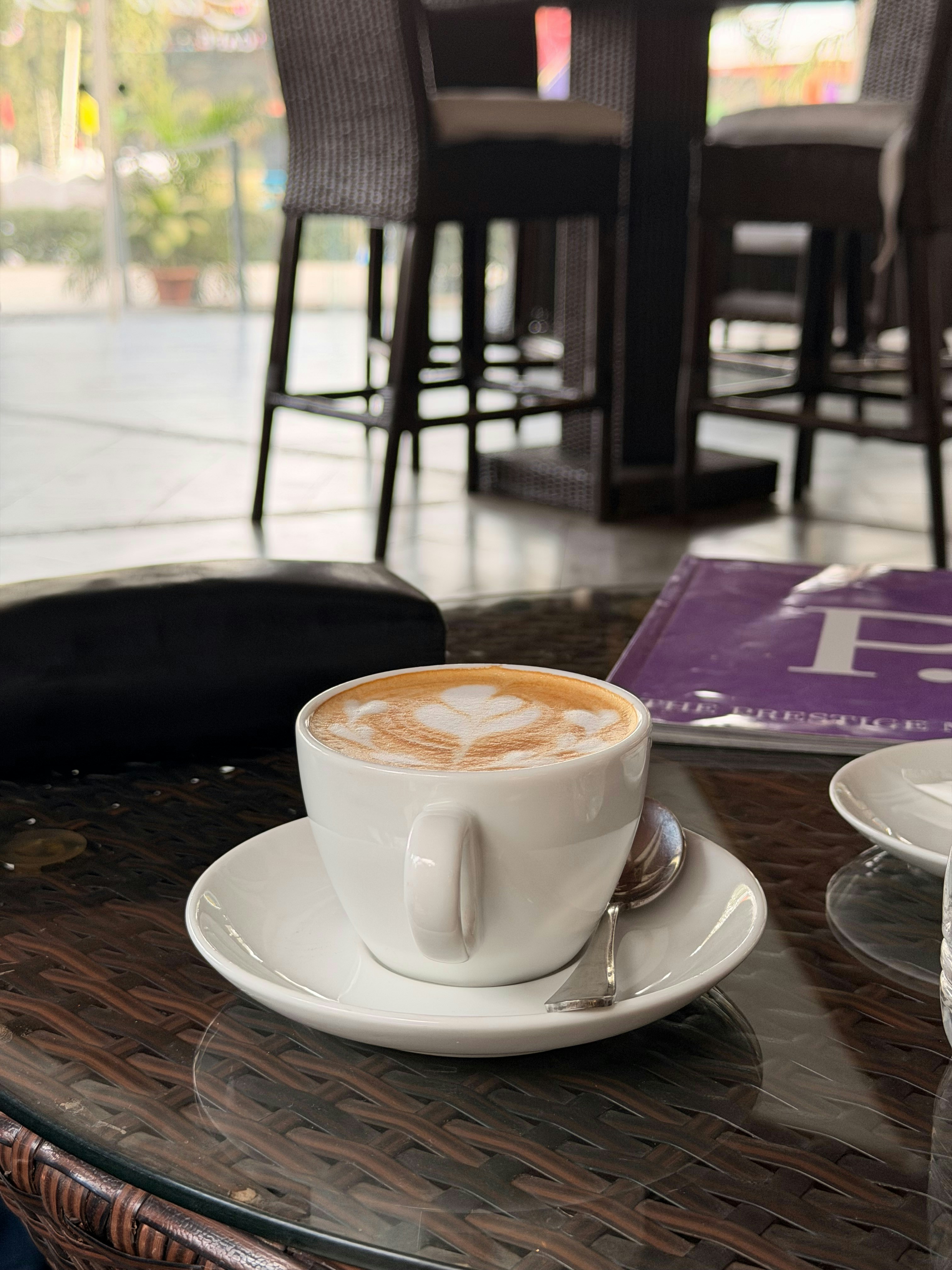 A latte with foam art on a saucer