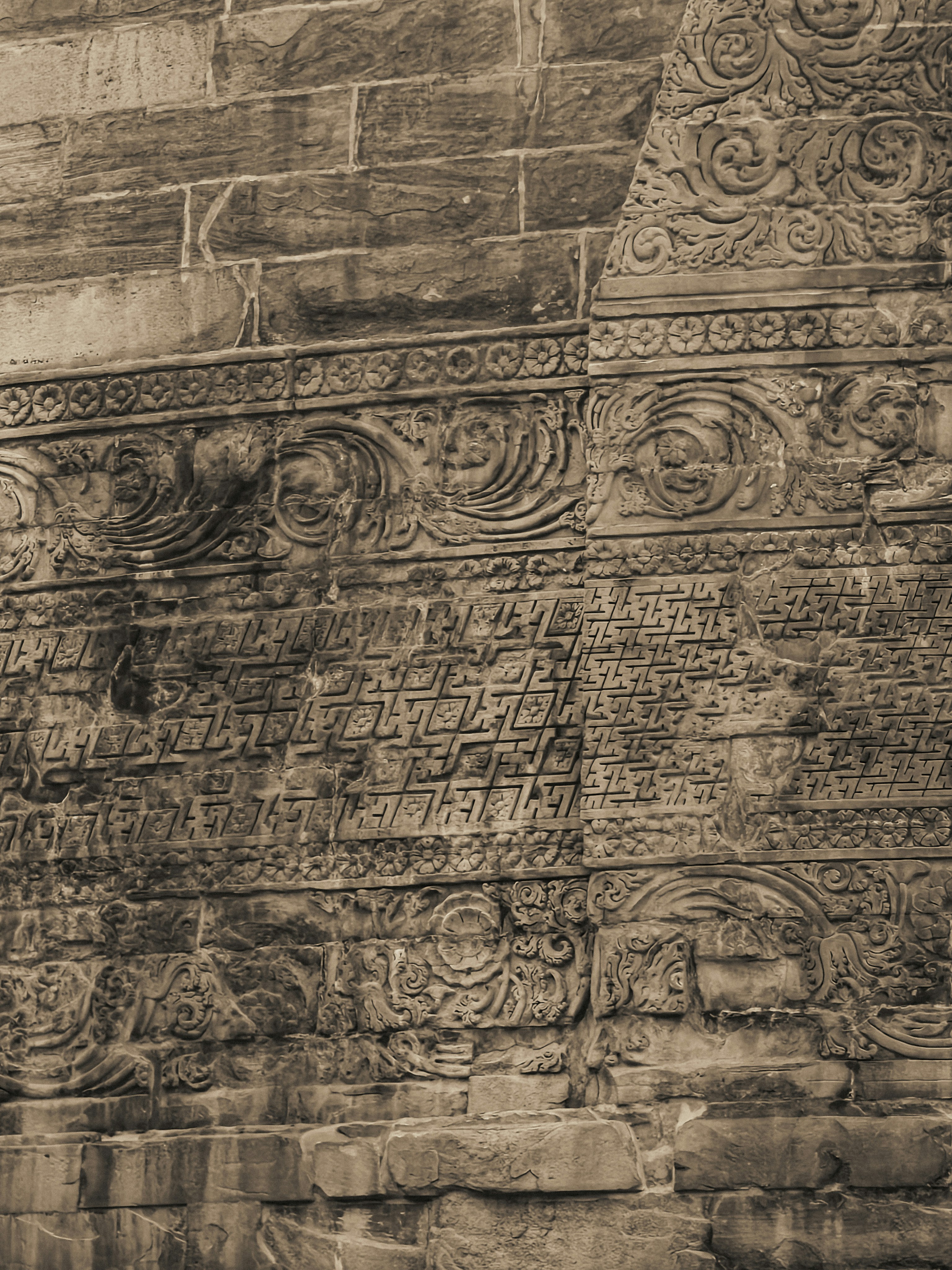 Intricate stone carvings on an ancient wall
