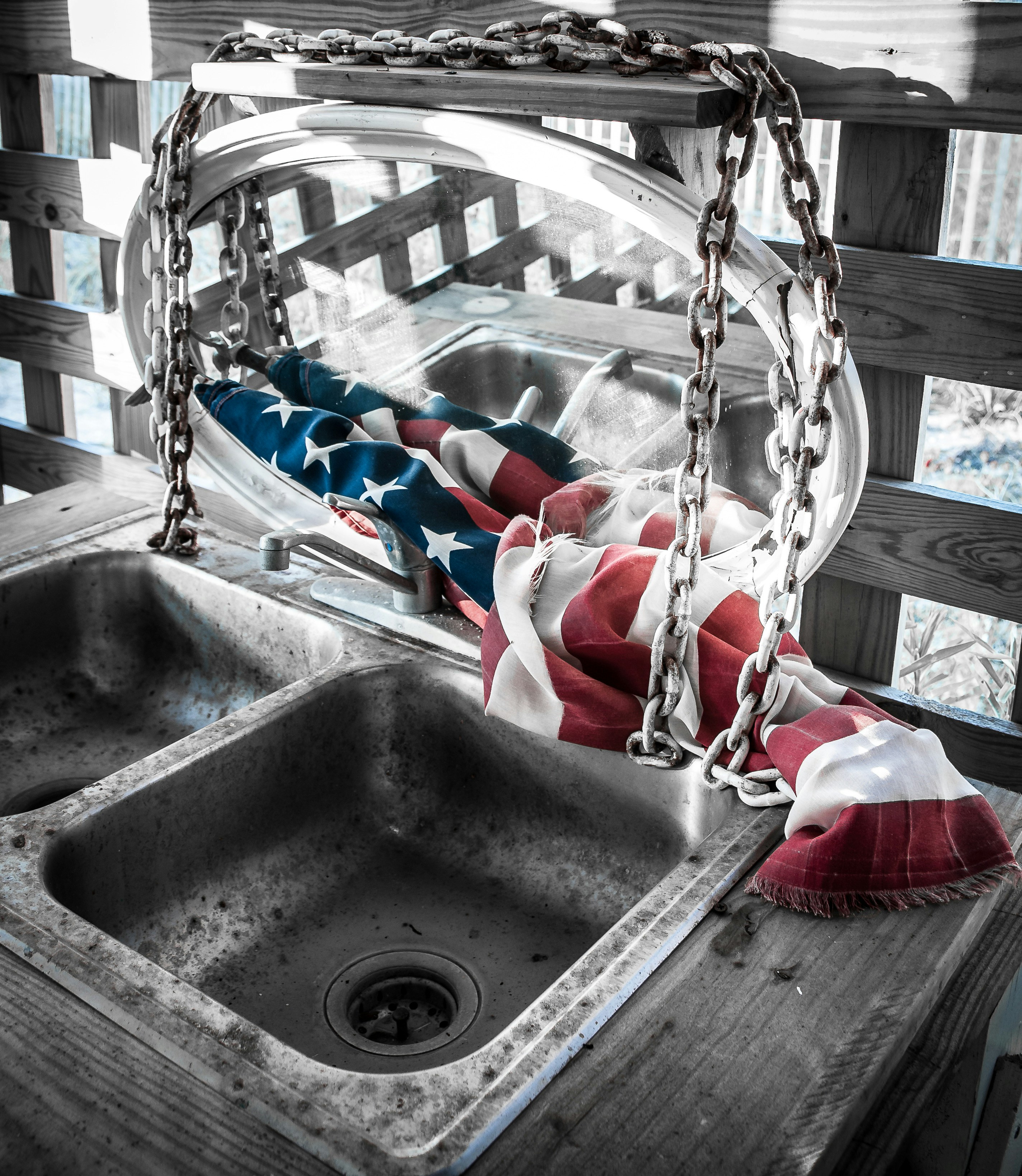 American flag draped over a double sink