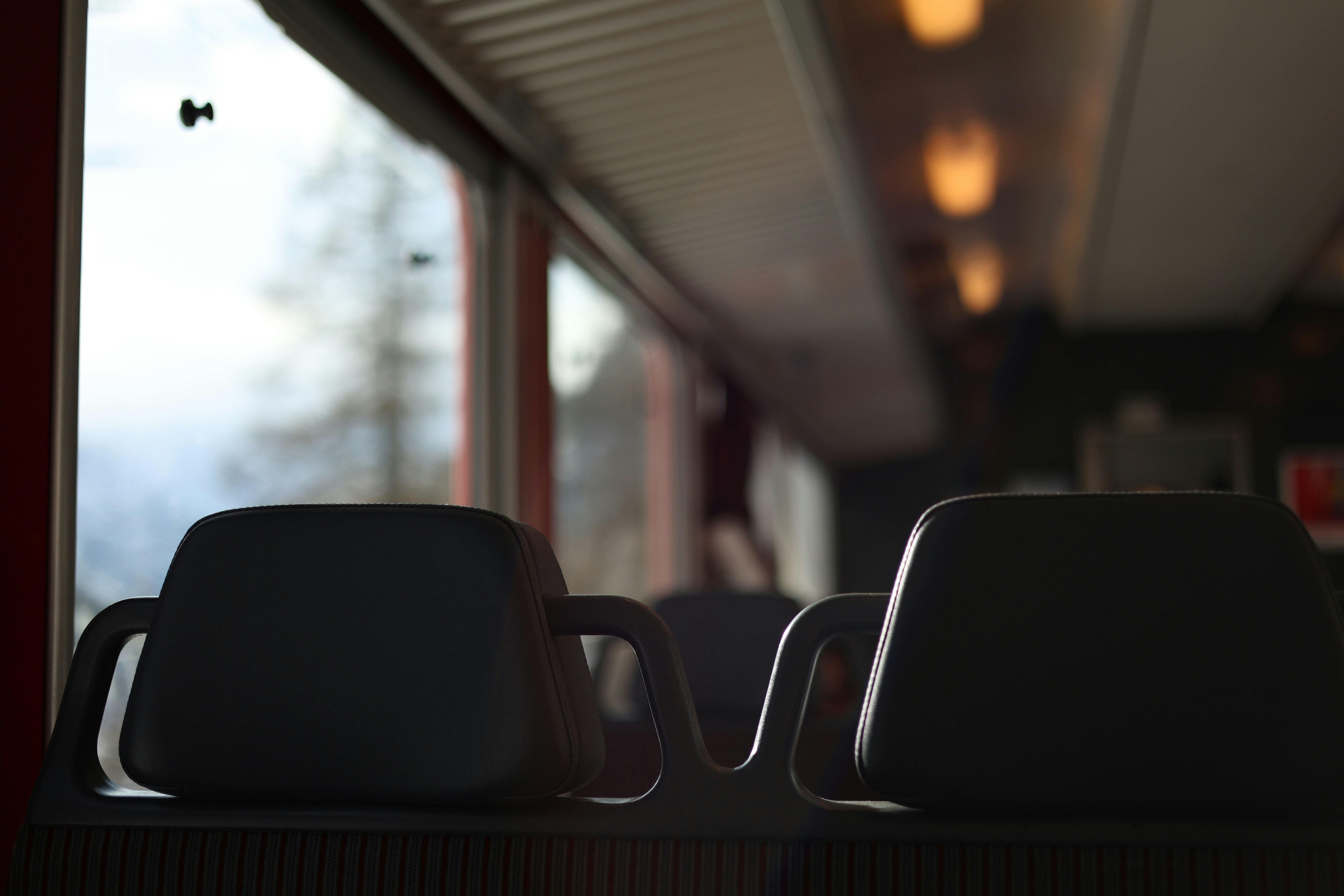 Interior of a train with window view of mountains
