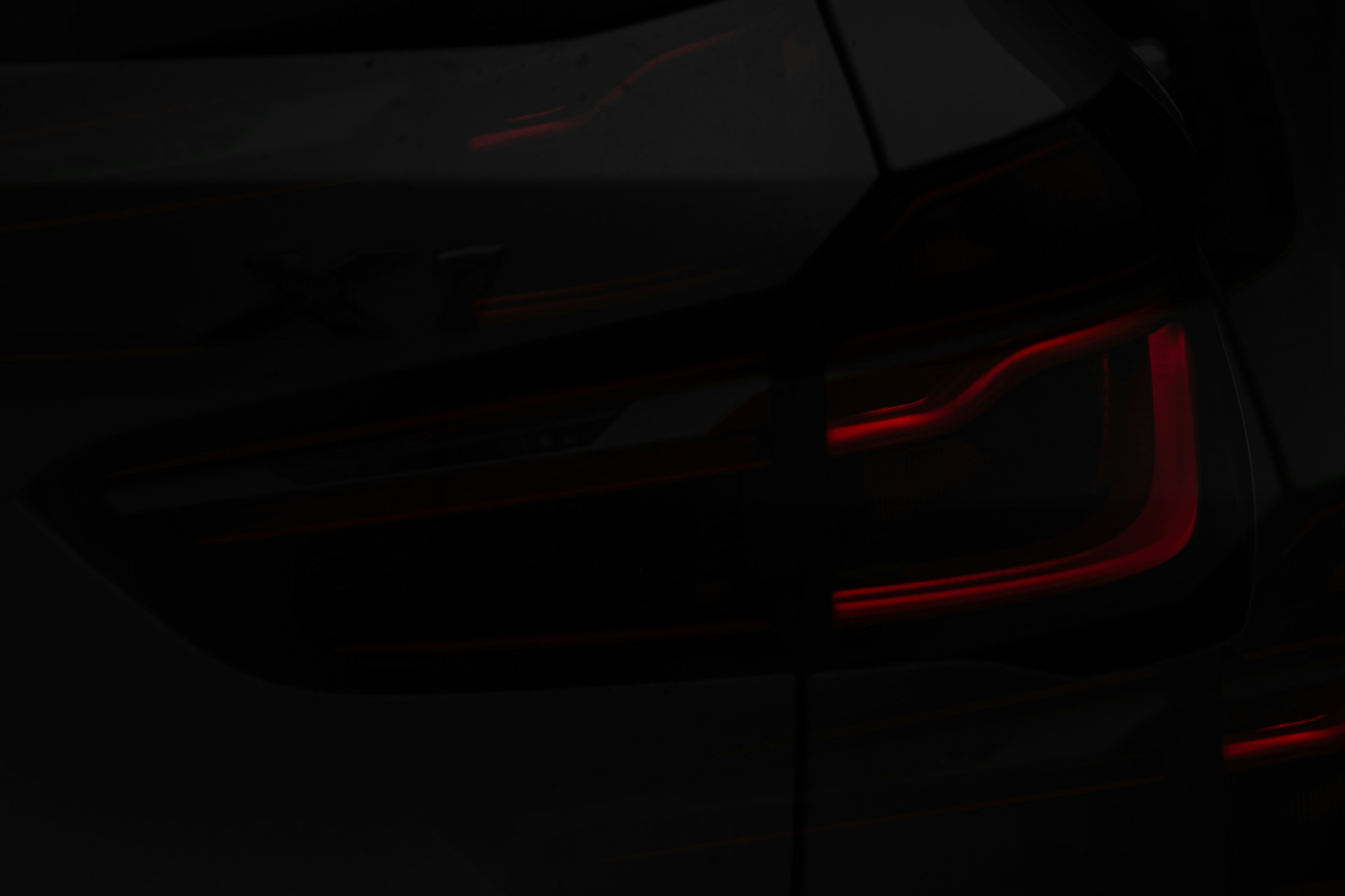 Close-up of a car's red taillight at night