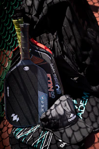 Two pickleball paddles, a hat, and a bag.