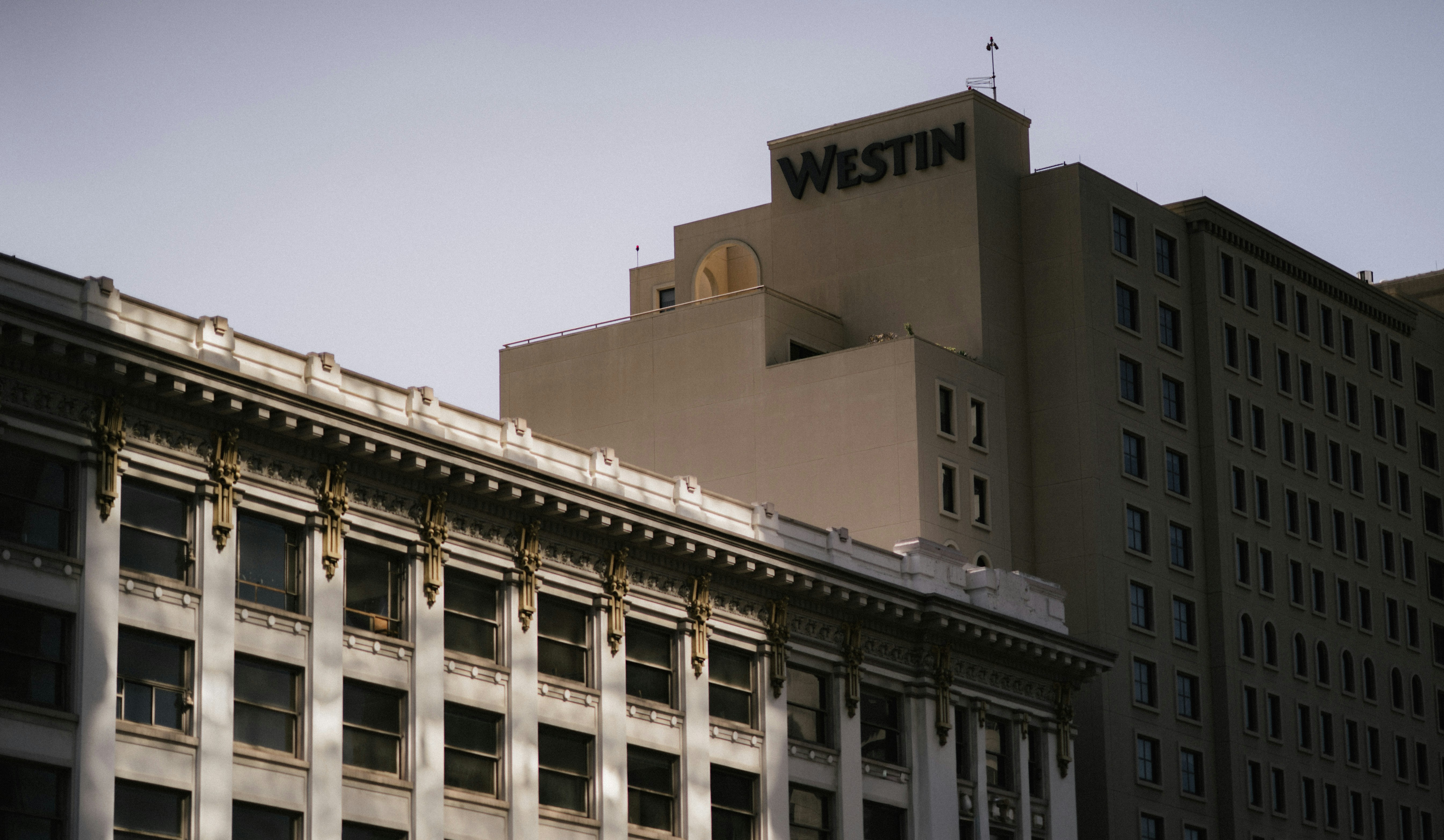 Westin hotel building against a clear sky