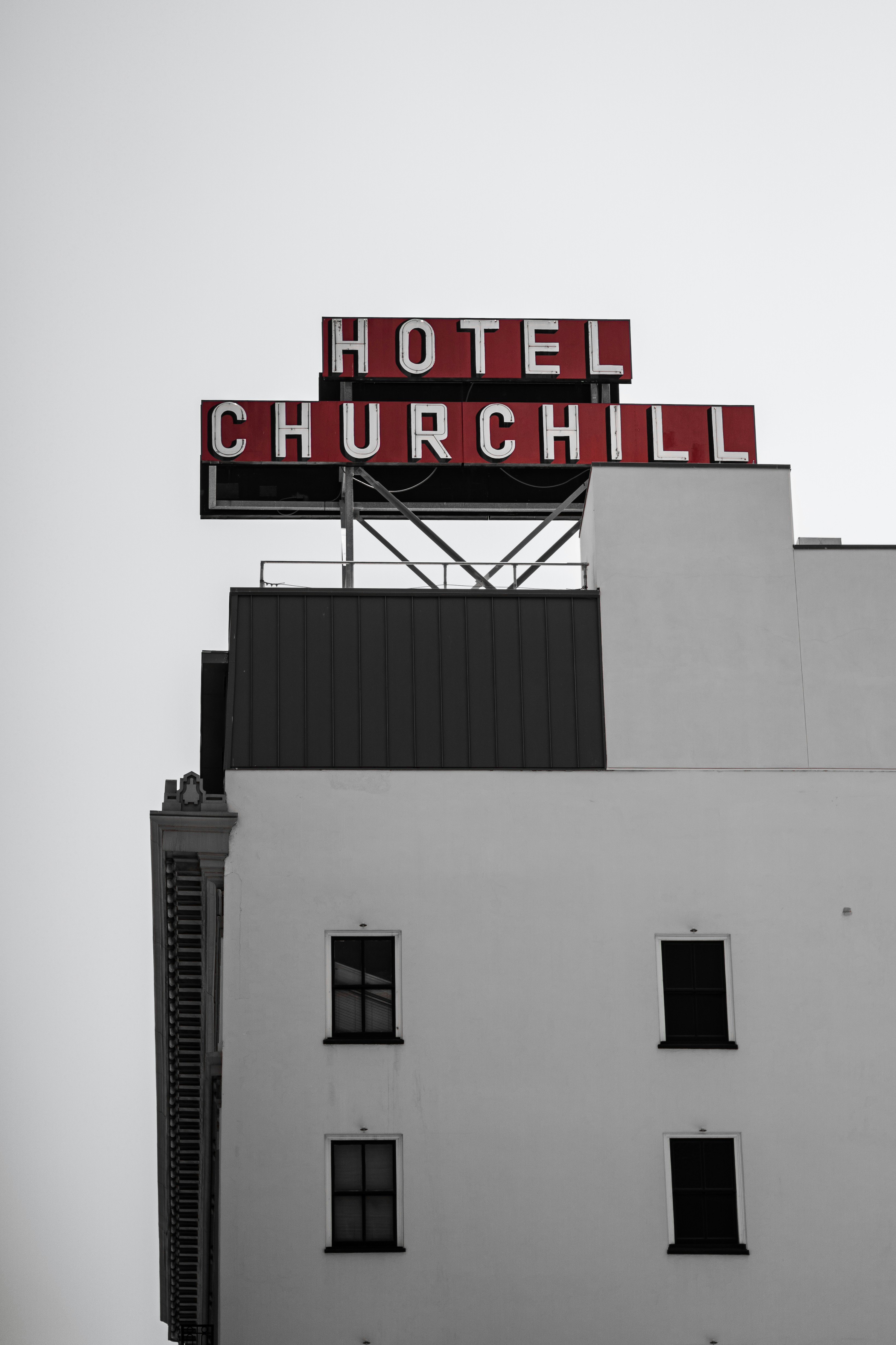 Hotel churchill sign on a white building