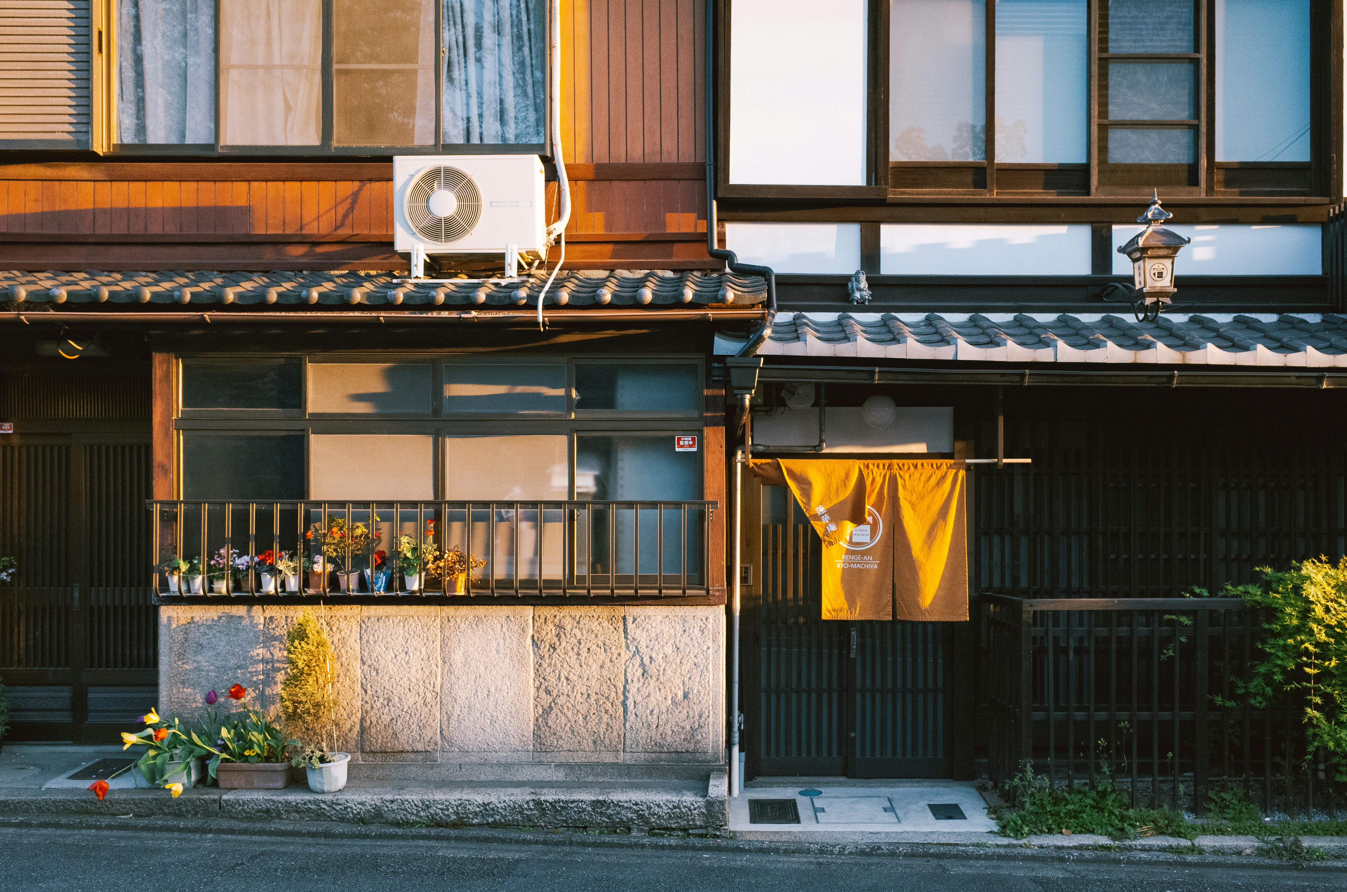 Two traditional japanese buildings with warm sunlight.