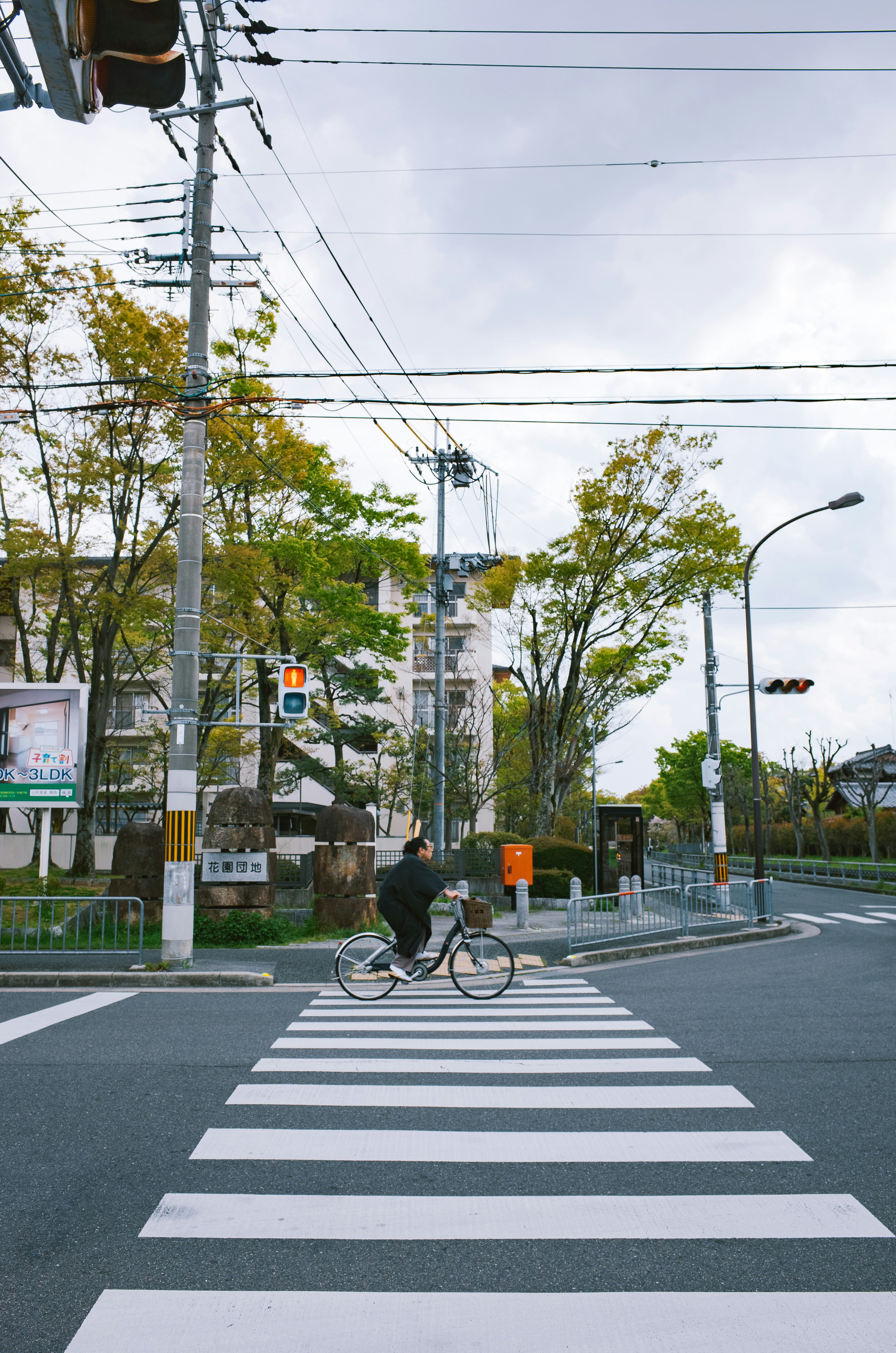 Person riding bicycle across a crosswalk