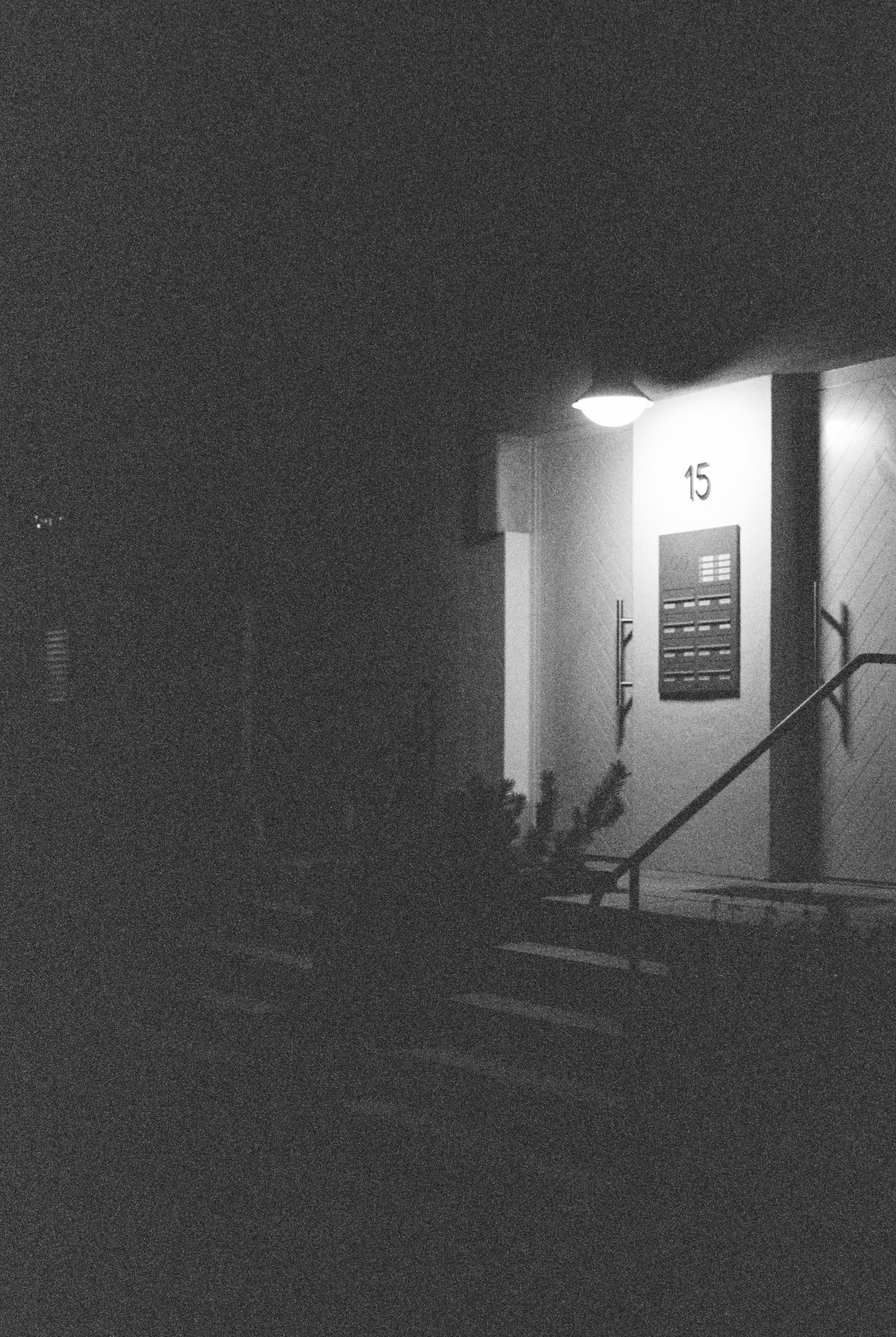 Entrance to a building at night with number 15