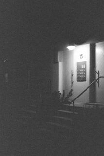 Entrance to a building at night with number 15