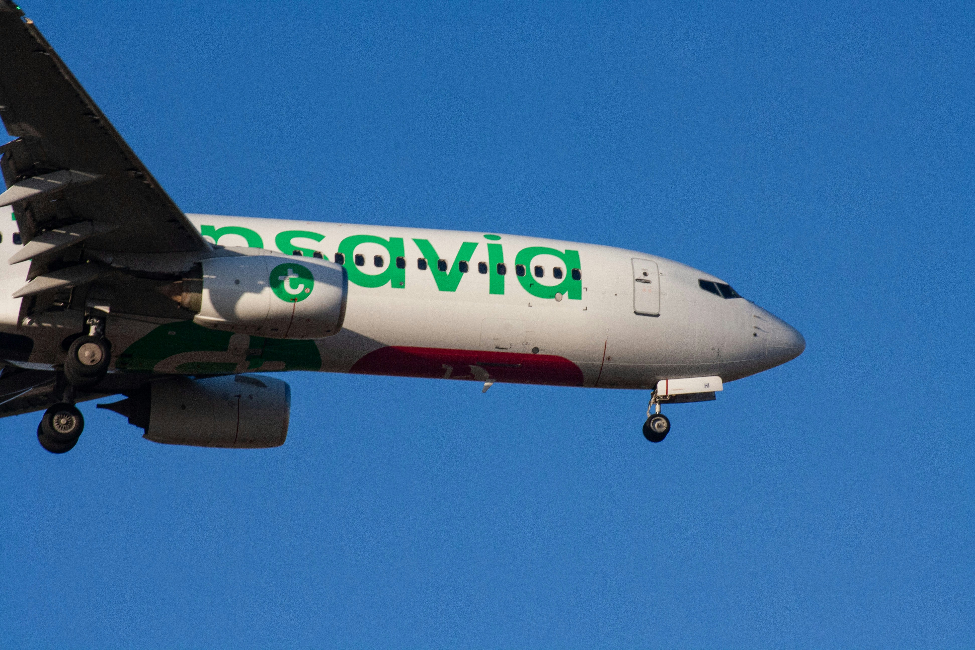 Transavia airplane flying in a clear blue sky