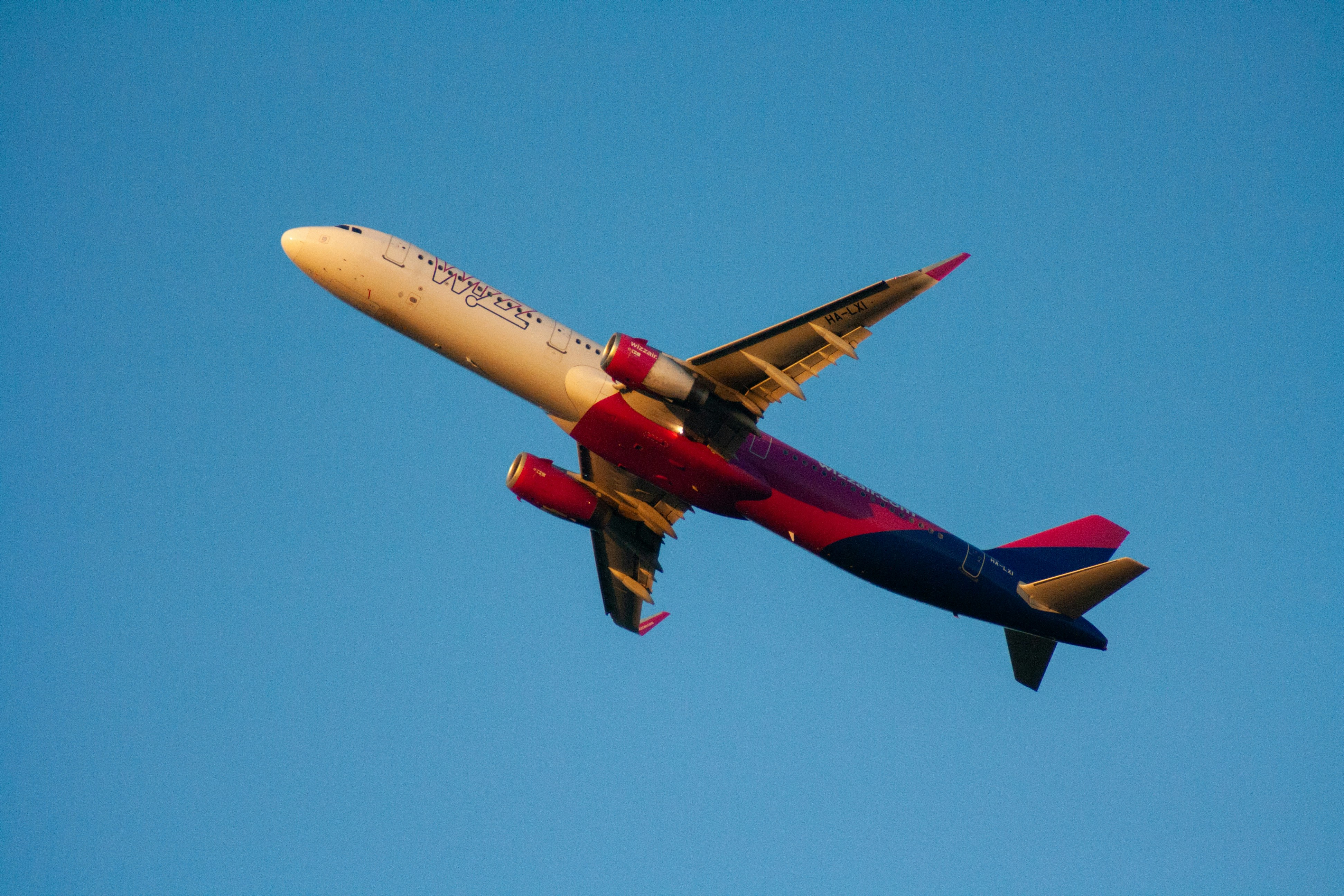 A commercial airplane flying in a clear blue sky