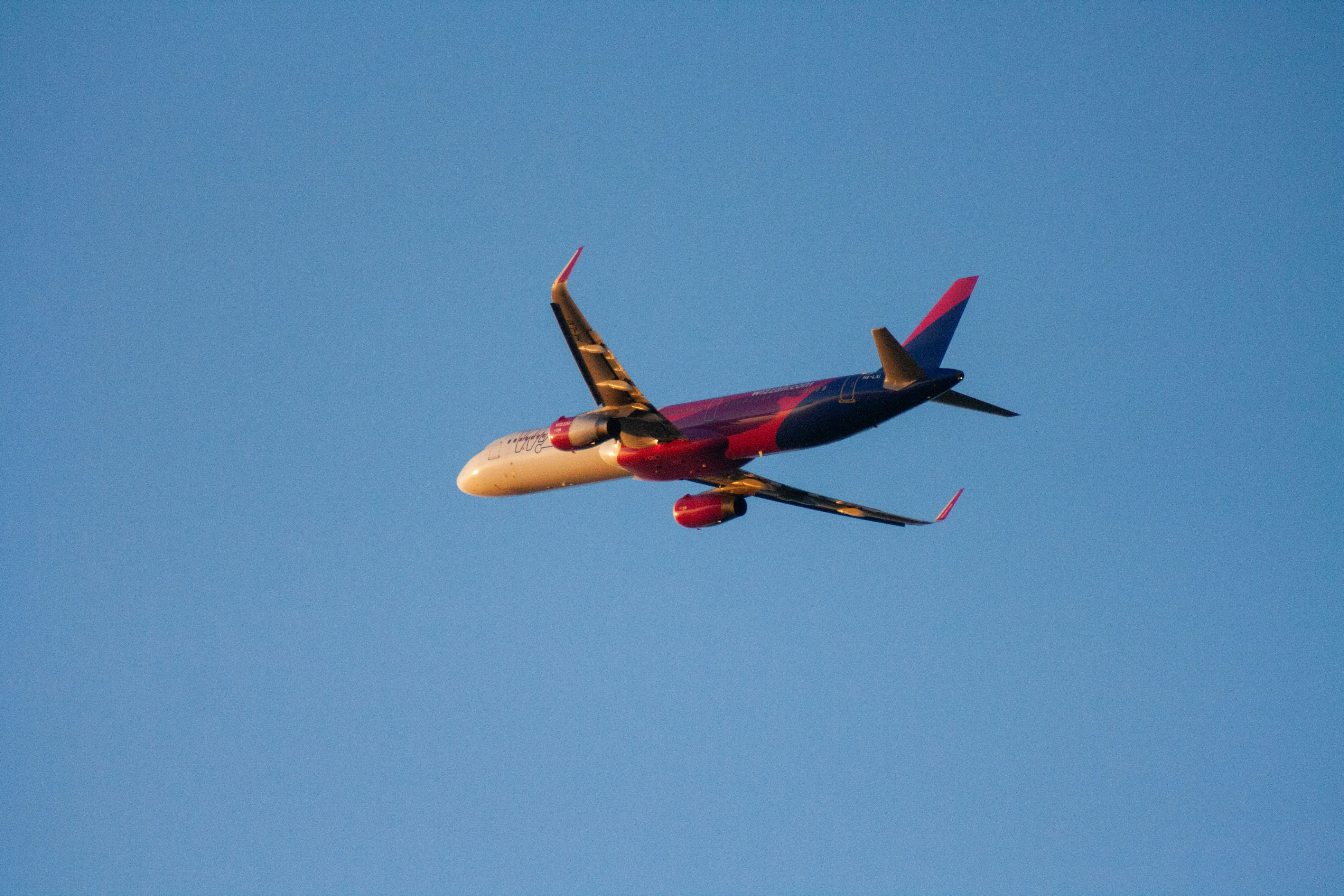 Airplane flying against a clear blue sky