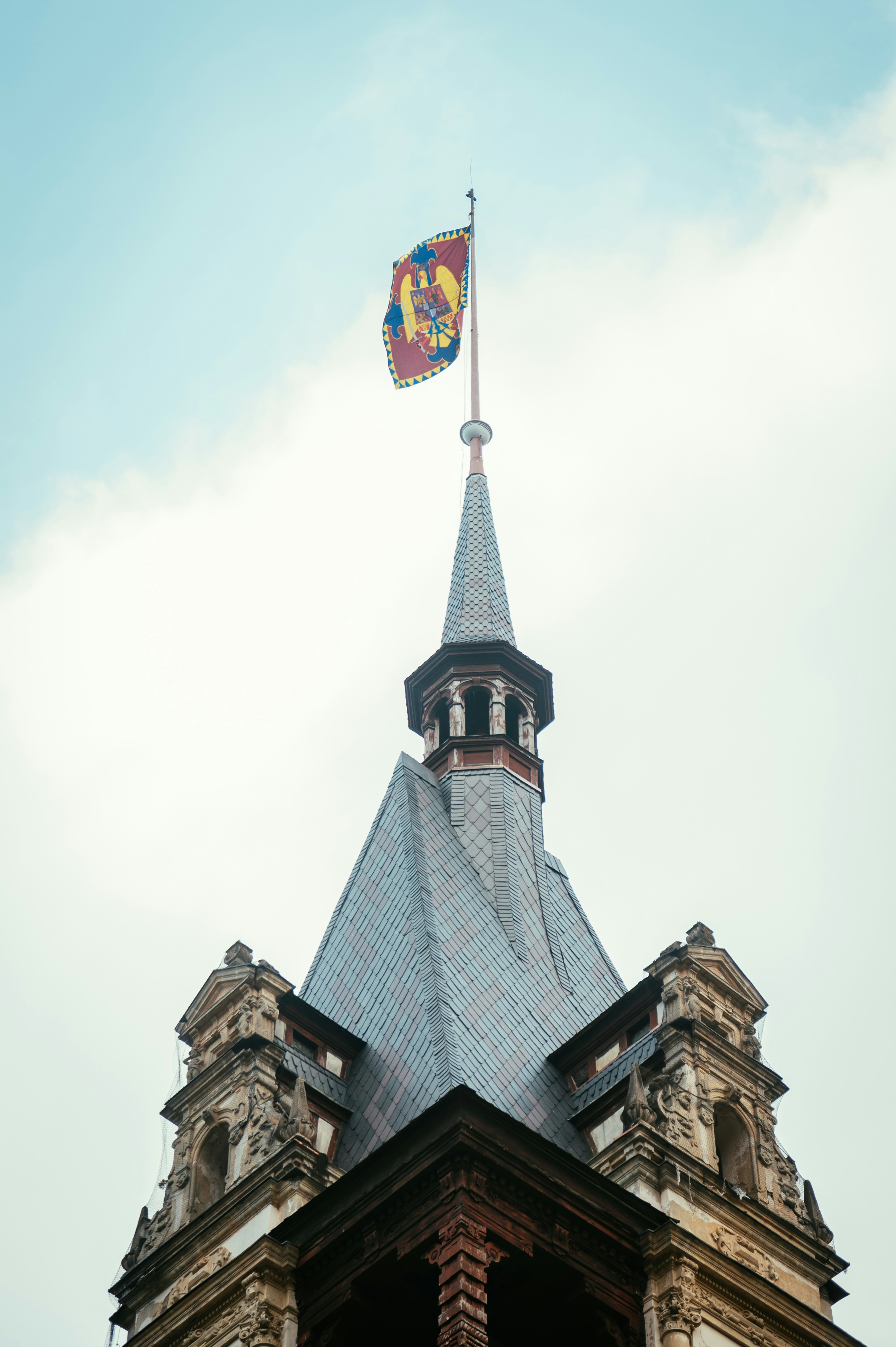 A flag flies atop a castle tower