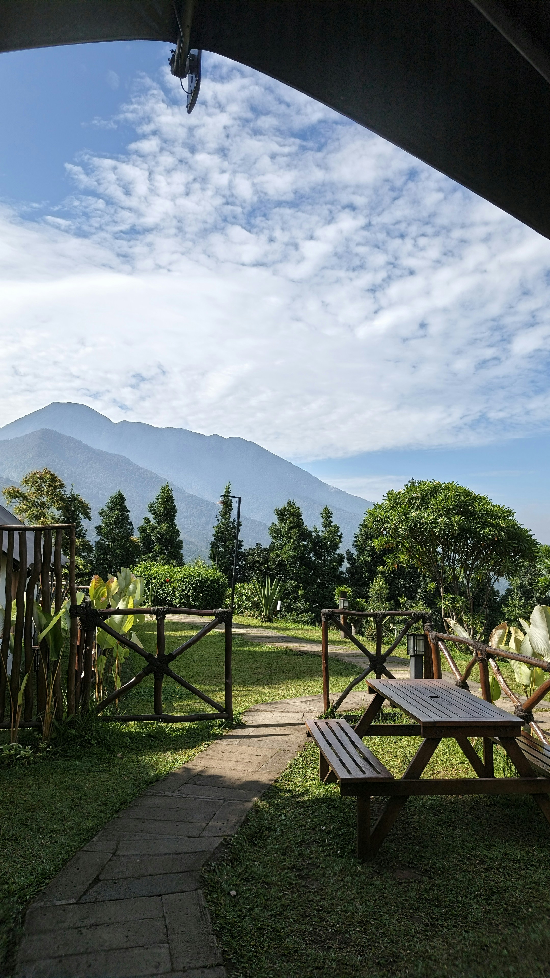 Mountain landscape with a picnic table and grassy area