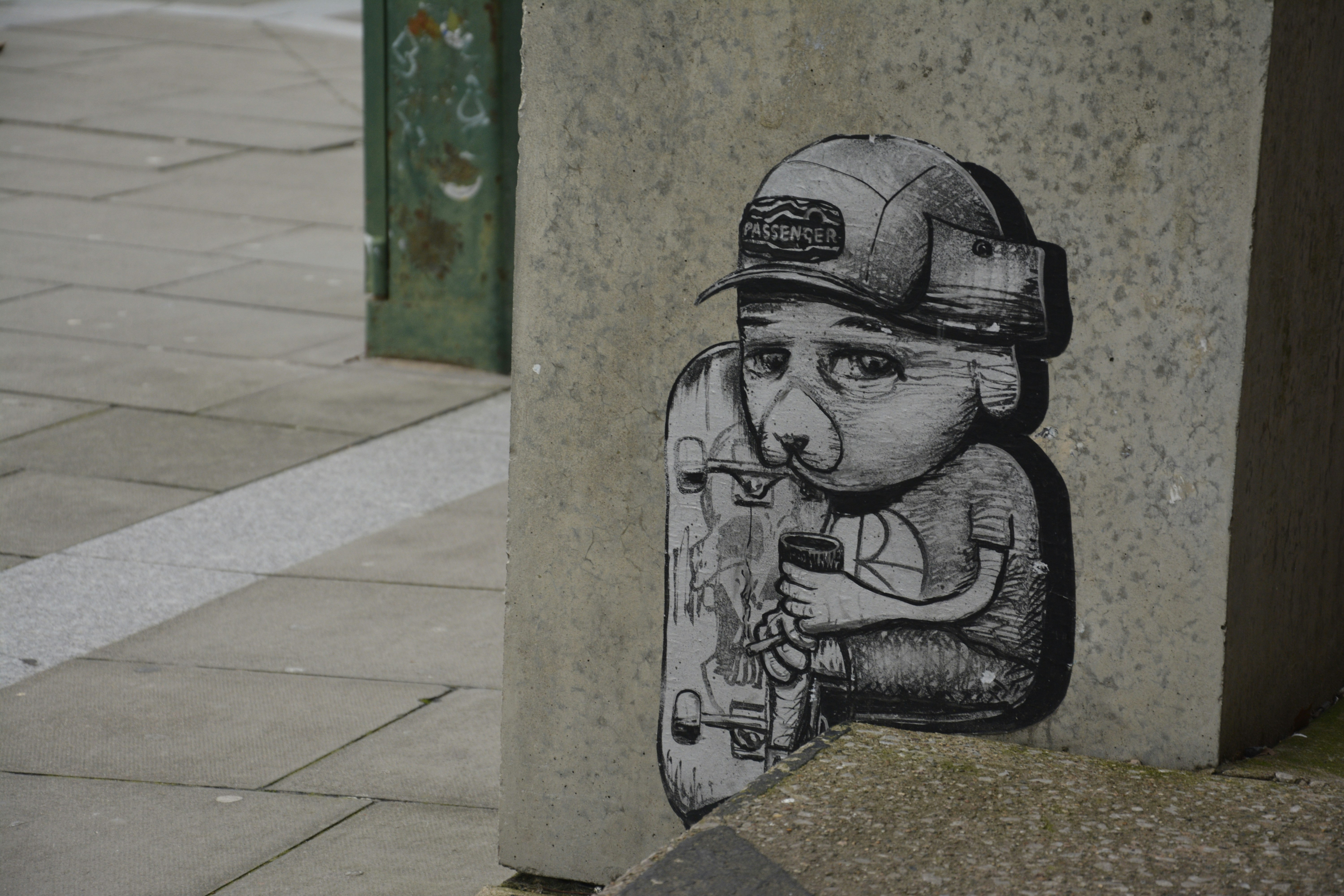 Graffiti art of a sad boy with a skateboard