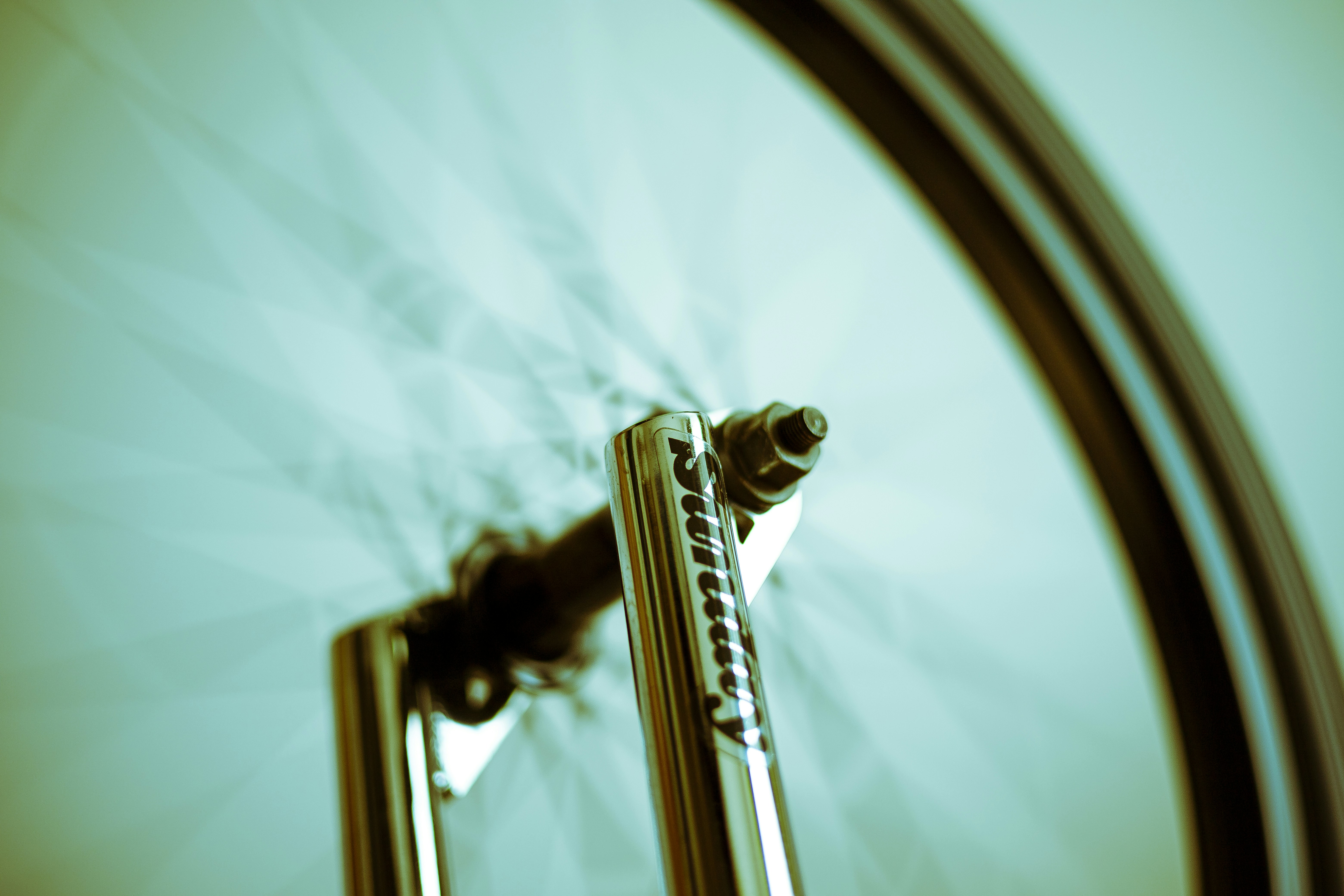 Close-up of a bicycle wheel and fork