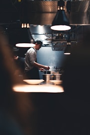 Chef preparing food in a busy kitchen