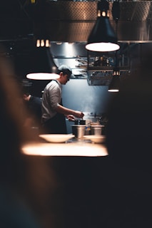 Chef preparing food in a busy kitchen