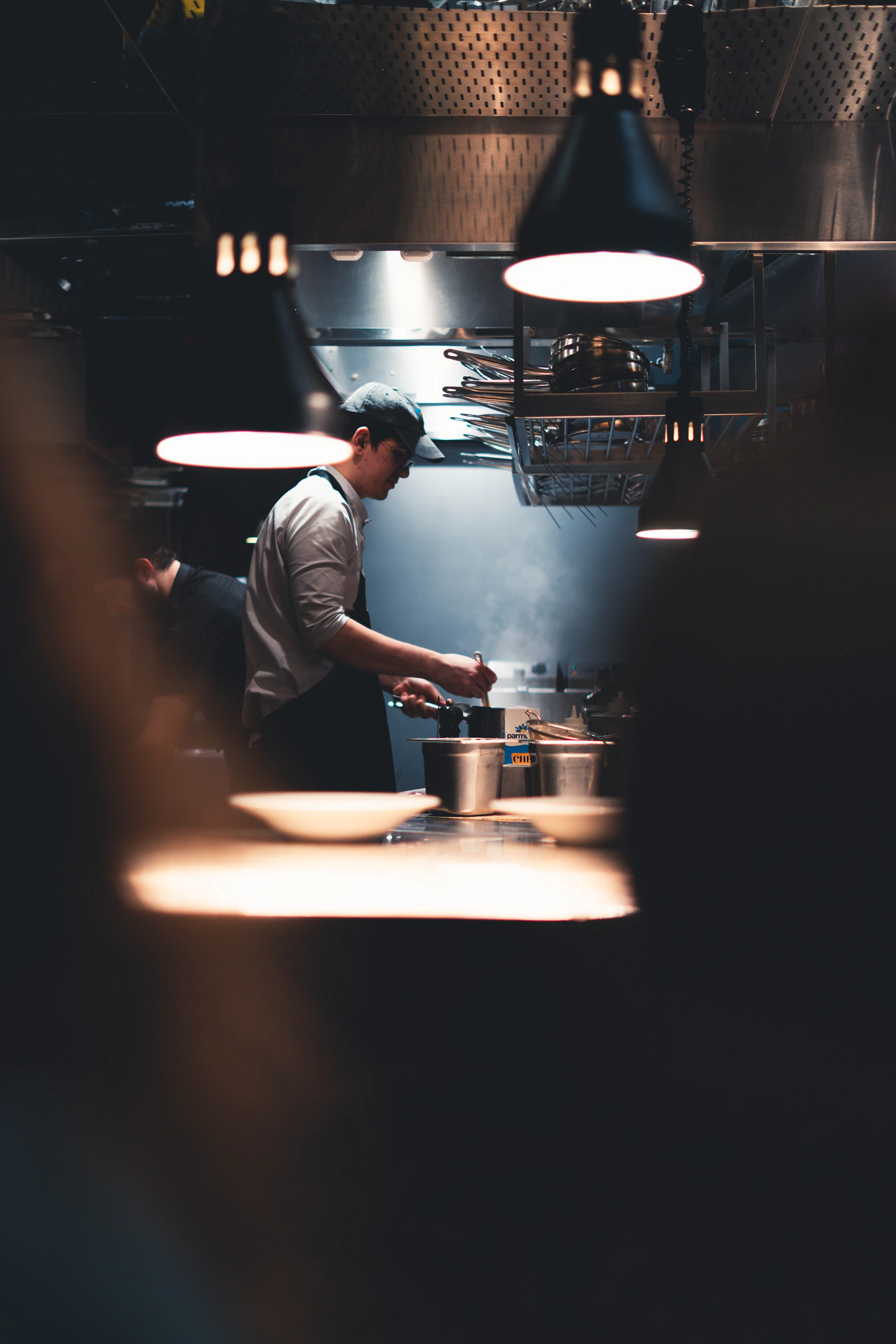 Chef preparing food in a busy kitchen