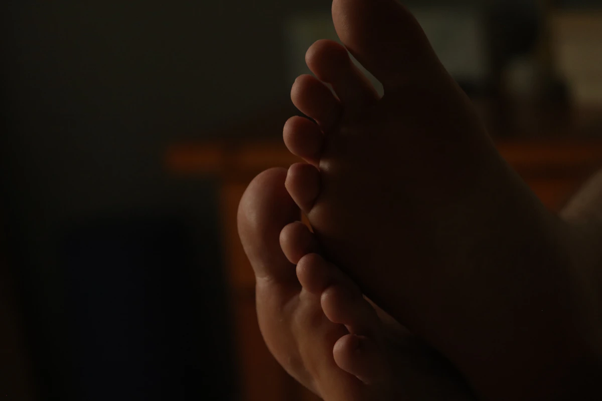 Close-up of bare feet, representing nail disorders and nail health assessment